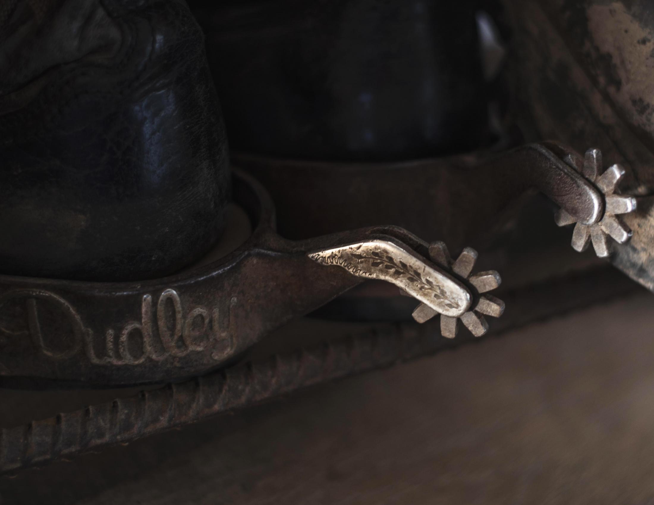 Boots with engraved spurs sit in Dudley&rsquo;s garage. Dudley always wears spurs on his...