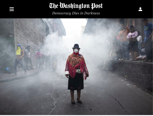 An indigenous woman wears a mas...o. (David Diaz Arcos/Bloomberg)