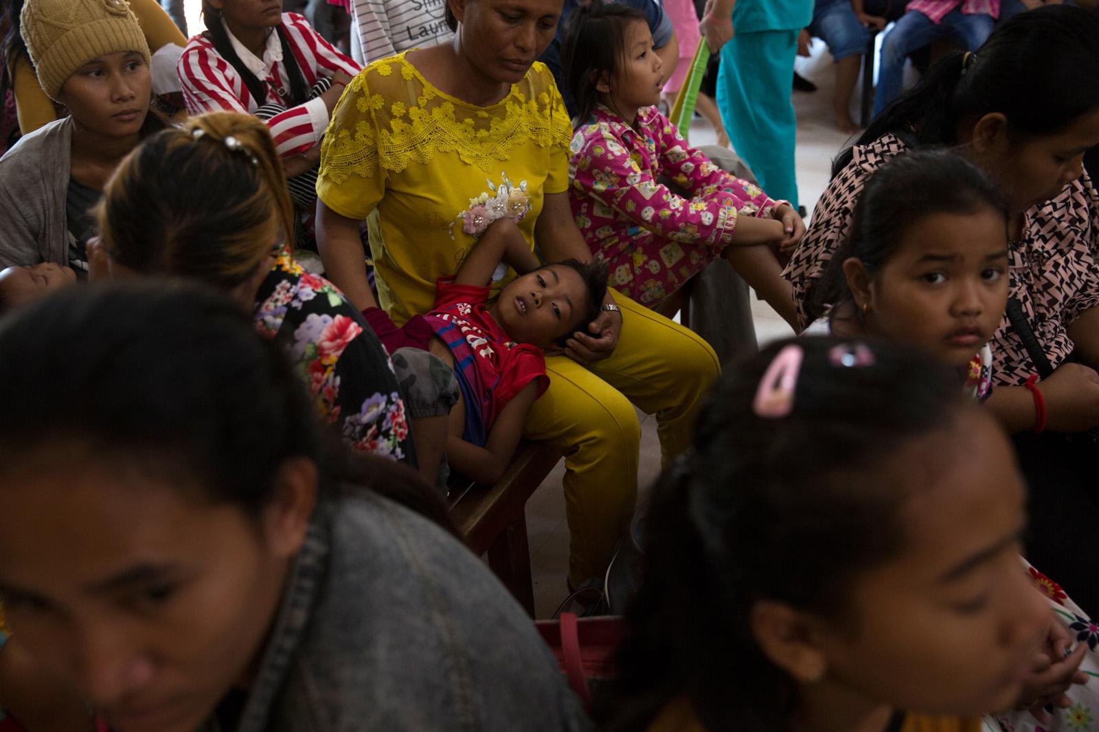 SOUTHEAST ASIA'S DENGUE EPIDEMIC - Mother Simdaly, 42, and her son Boreach, 6, wait to see...