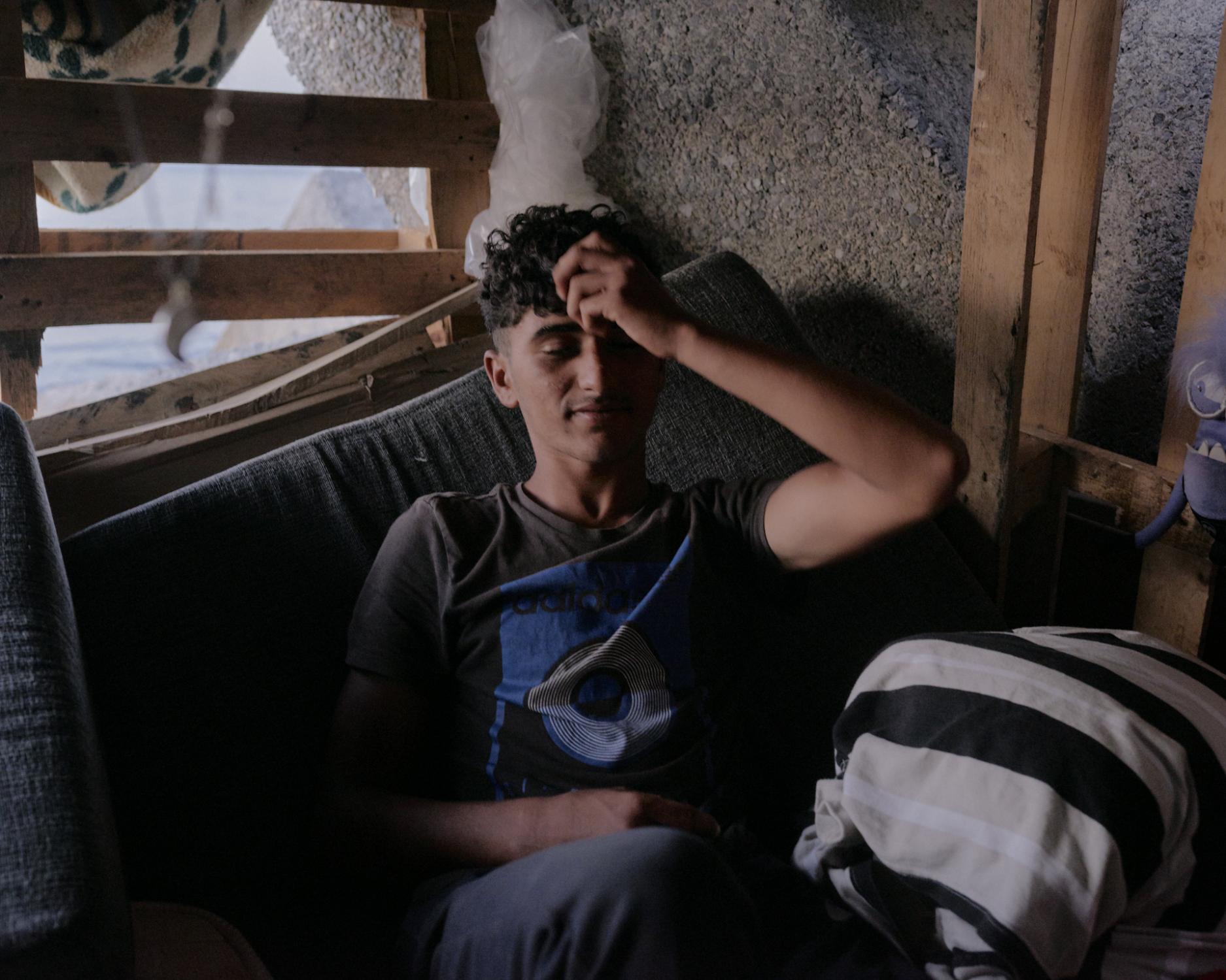  Halima, 14yr., left his home town of TetohuaÌn four months ago, lives in an improvised bed made...