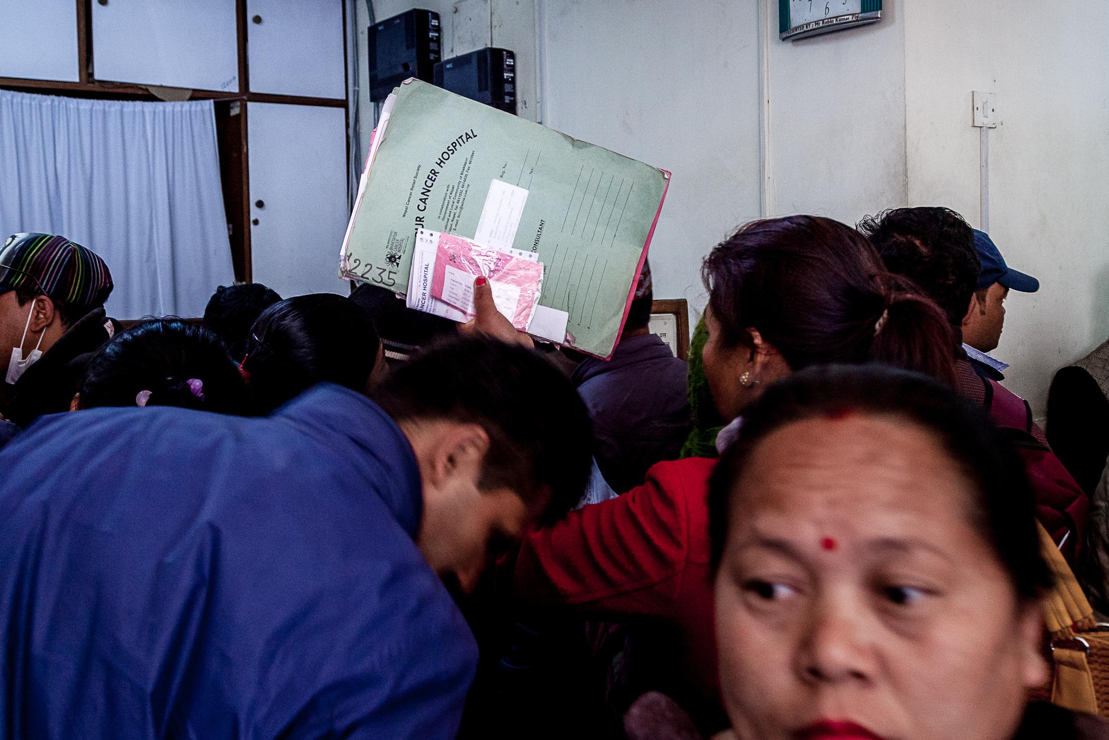 The Big C - BHAKTAPUR, NEPAL- FEBRUARY 02: A patient holds a folder...