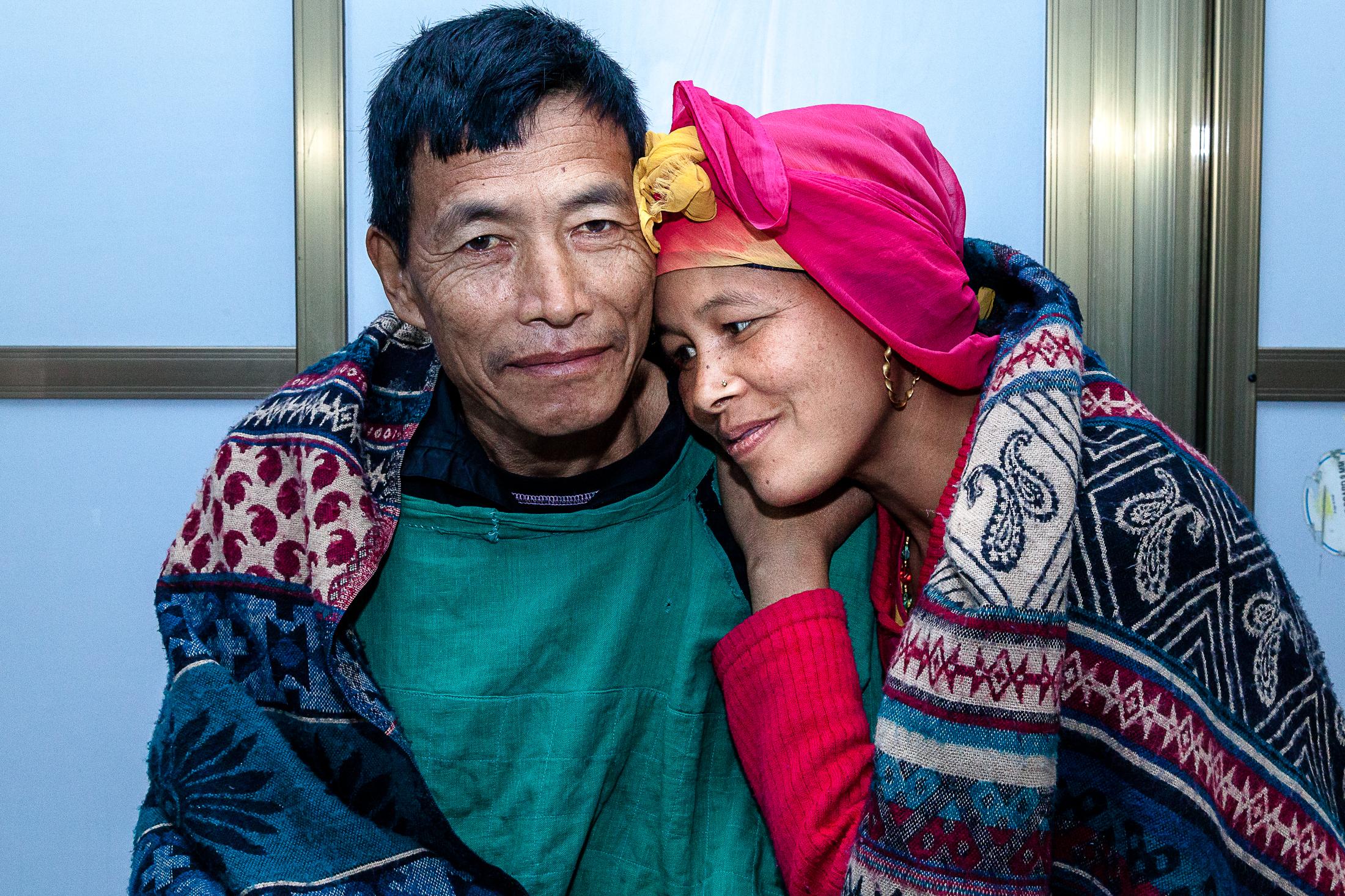 The Big C - BHAKTAPUR, NEPAL- FEBRUARY 02: A woman hugs her husband...