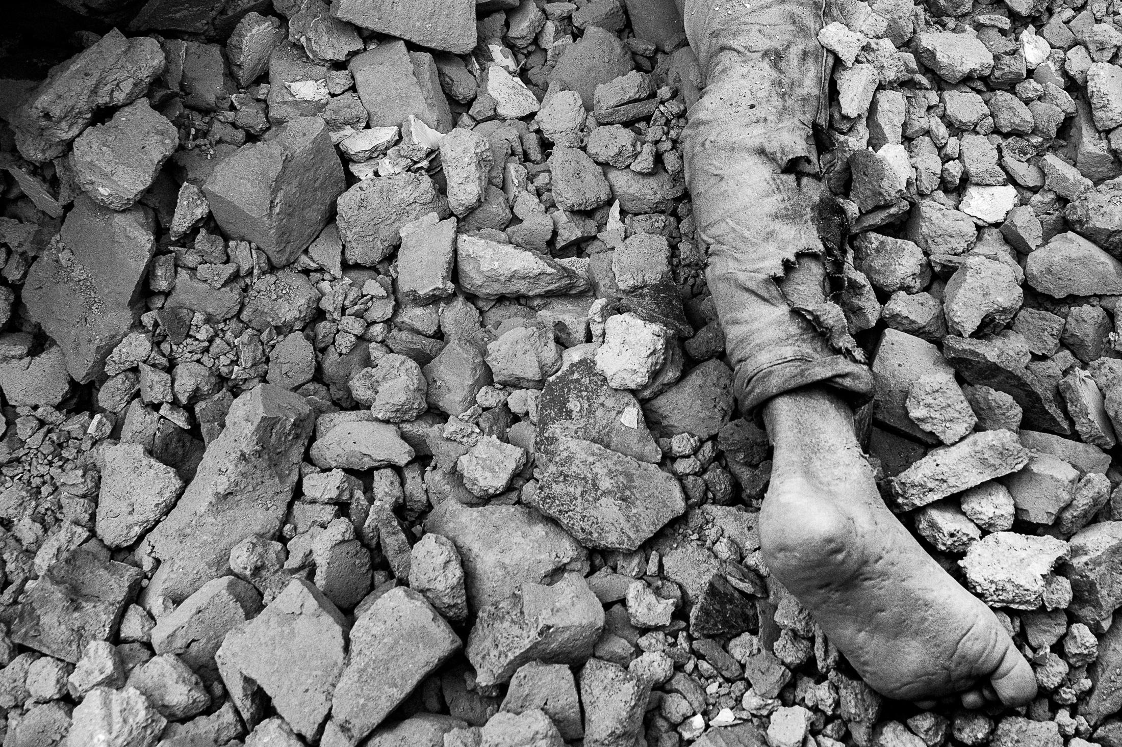 Endurance - KATHMANDU, NEPAL - APRIL 25: The body of a man lays dead...