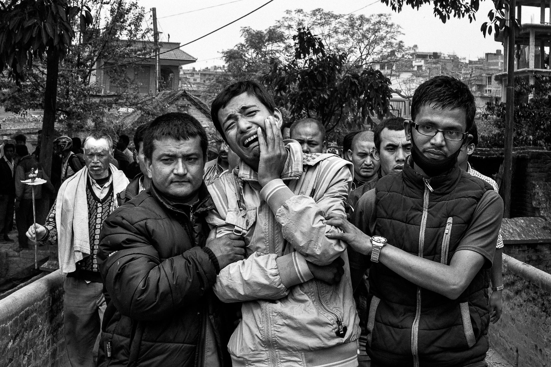 Endurance - BHAKTAPUR, NEPAL - APRIL 26: Relatives of a victim of the...