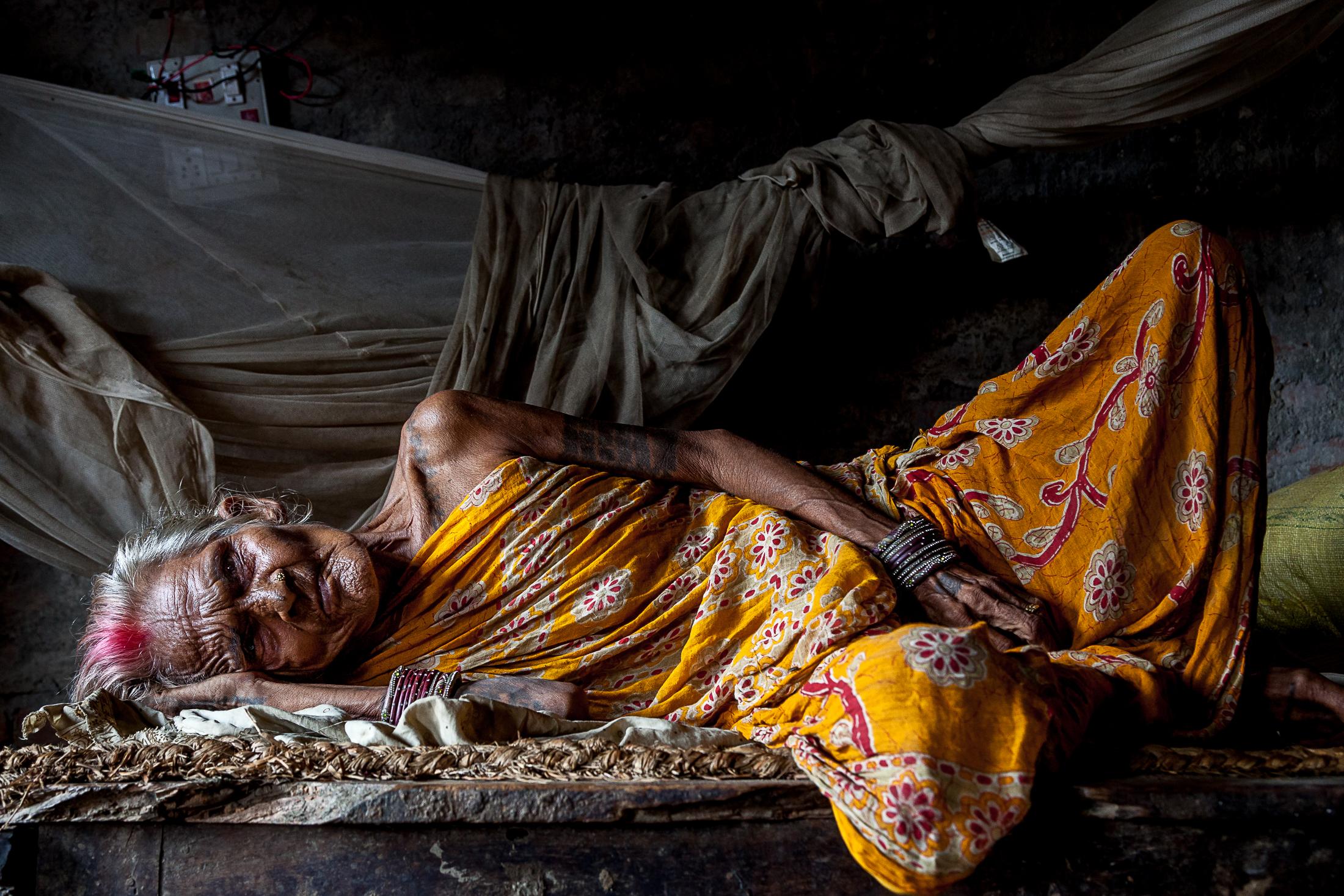 Breaking tradition among Nepal's Maithil women - JANAKPUR, NEPAL - JULY 24: An elderly Maithil woman lays...