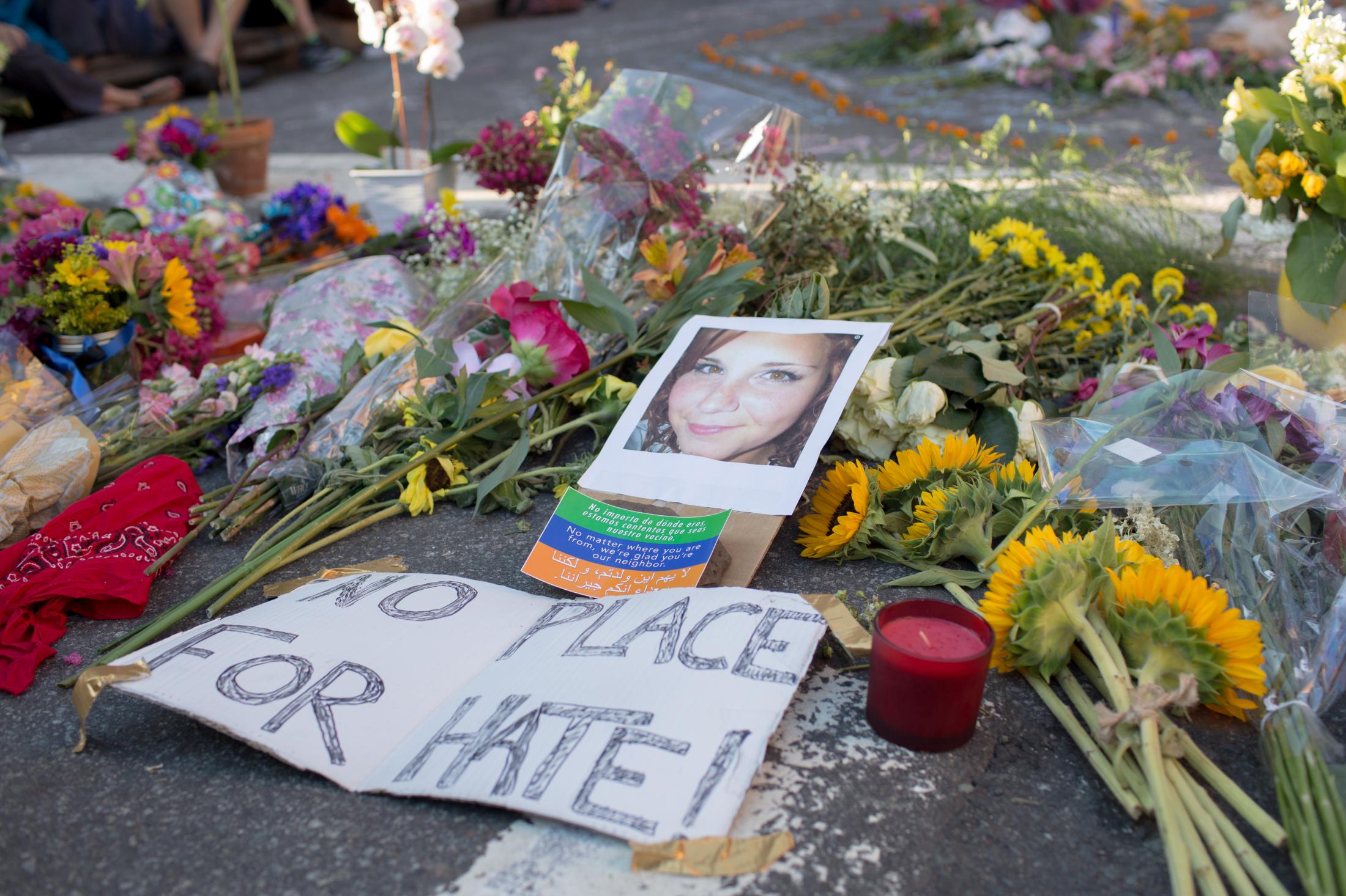 Charlottesville - A photo of Heather Heyer is placed at a memorial for her...