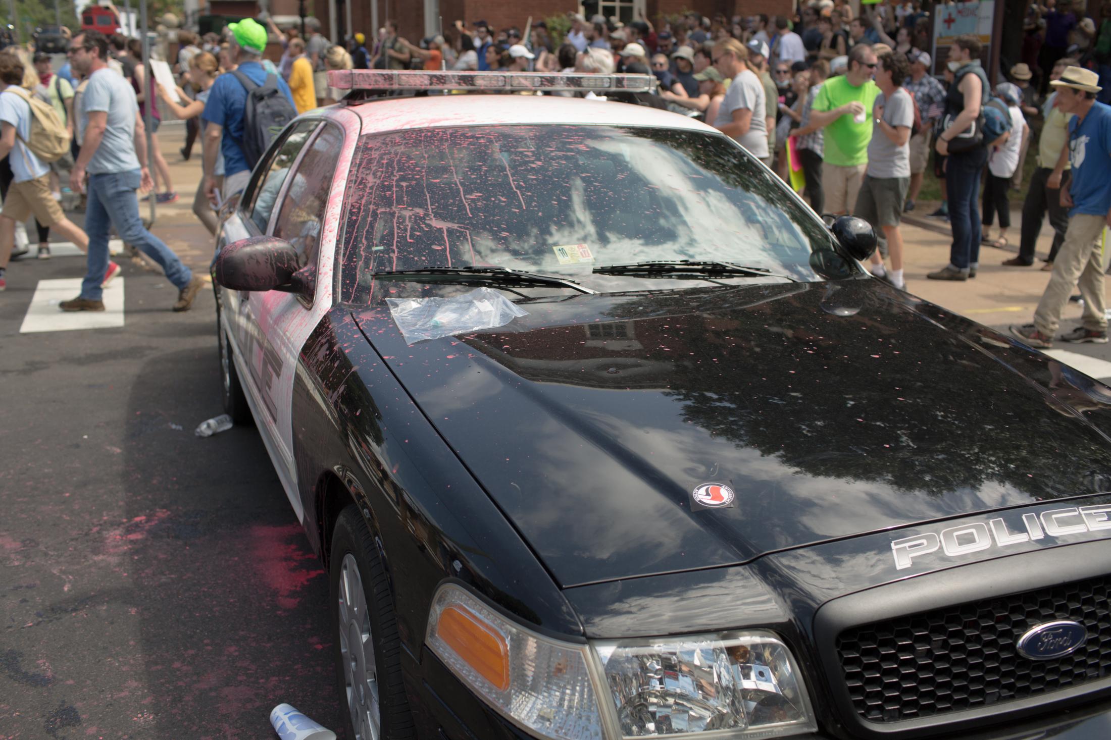Charlottesville - A police car parked outside of Emancipation Park for the...