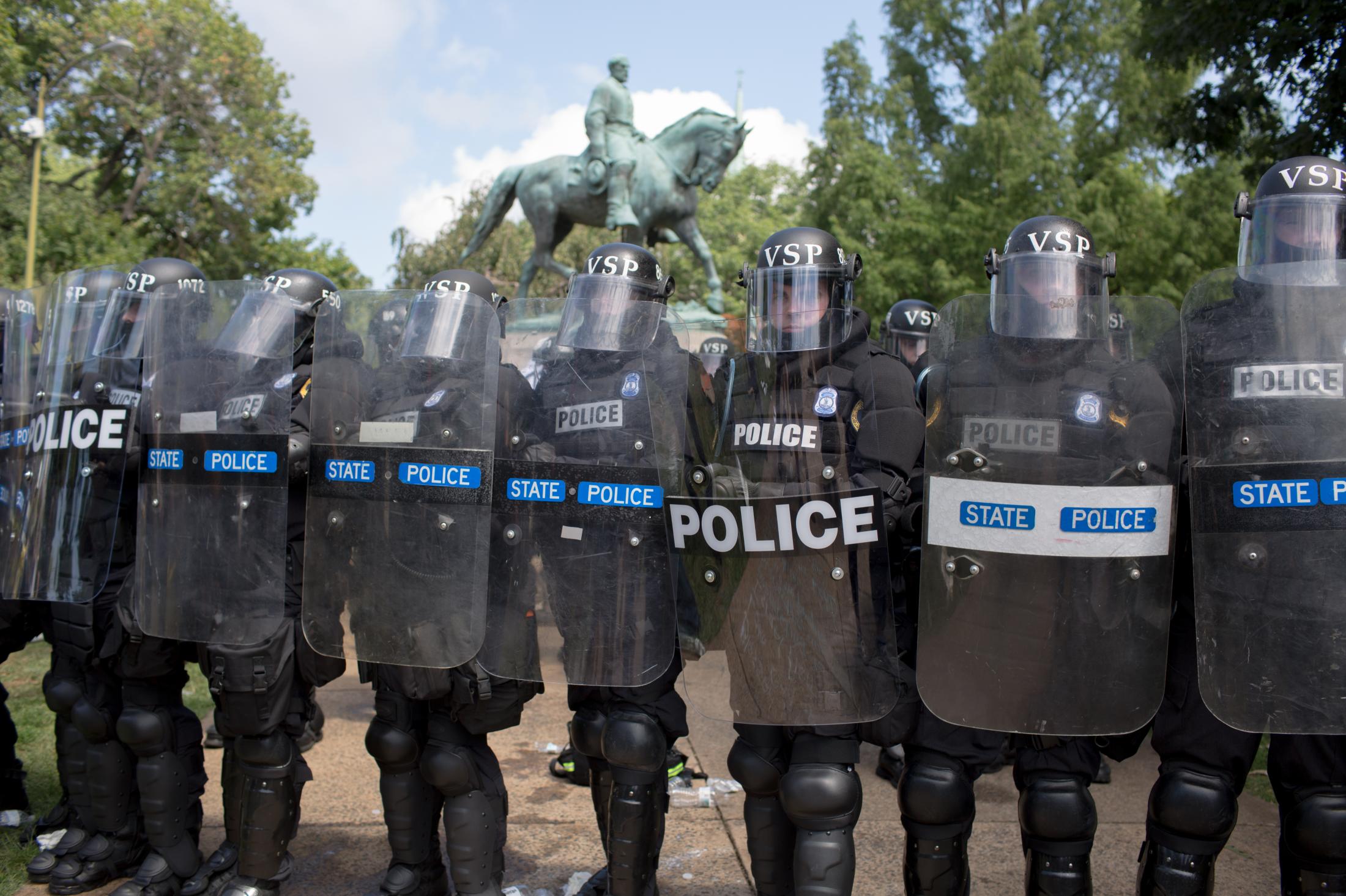 Charlottesville - Virginia State Police in riot gear form a line in front...