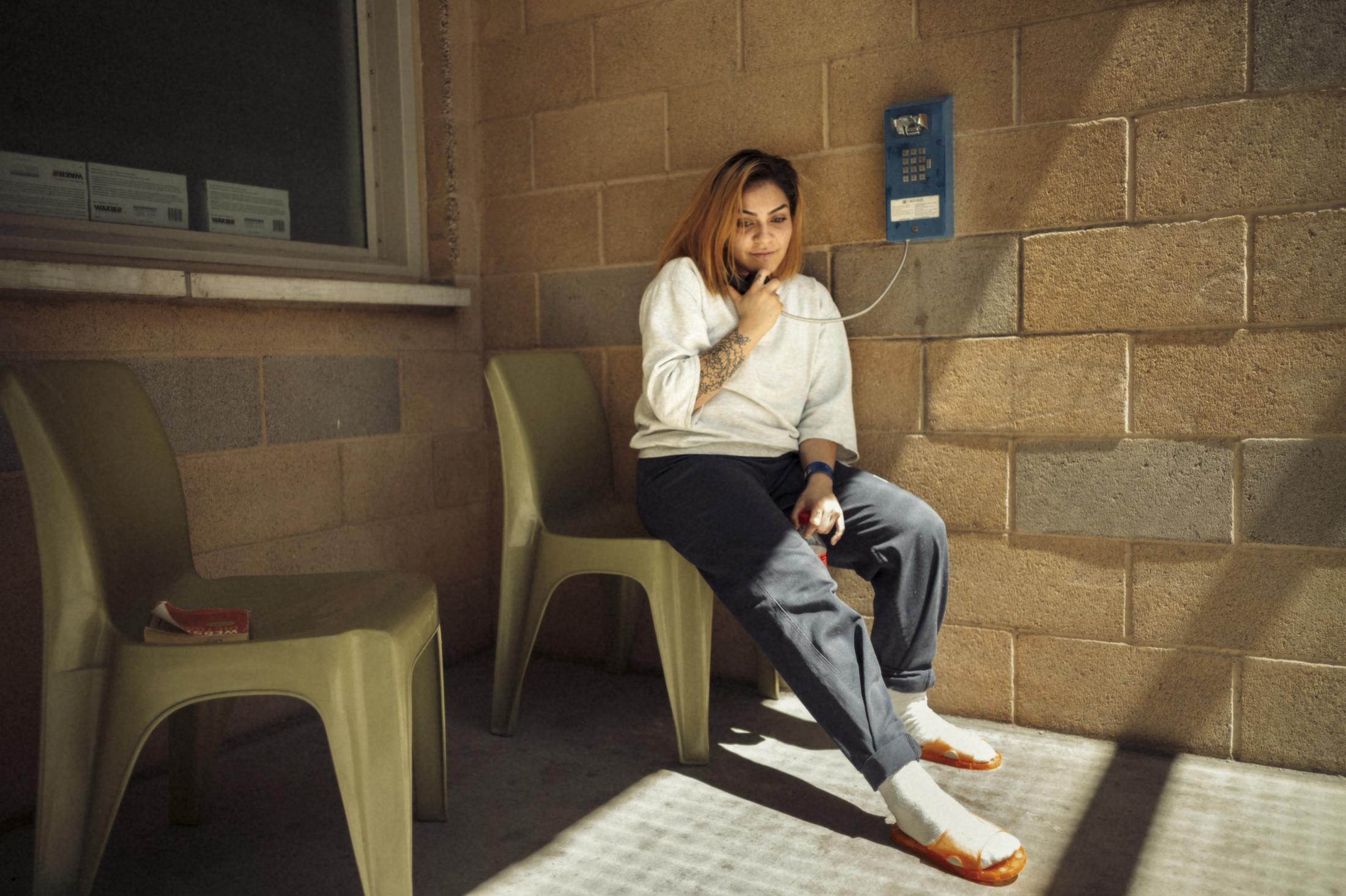 Mothers & Sisters - Laura Mejia speaks on the phone from the exercise yard in...