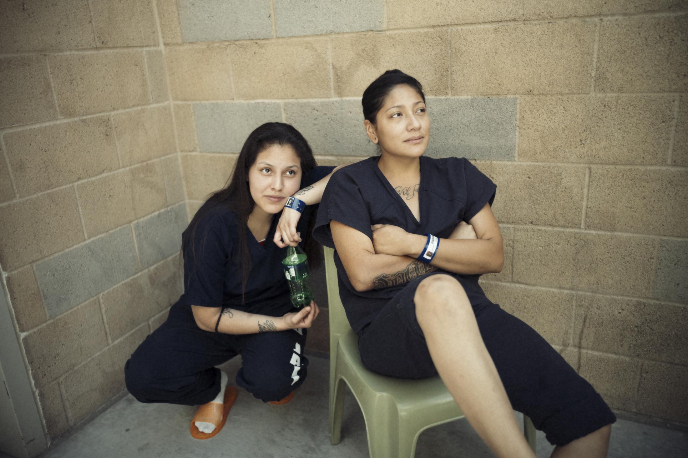 Mothers & Sisters - Pamela Hernandez and Kathleen Salinas sit together in the...