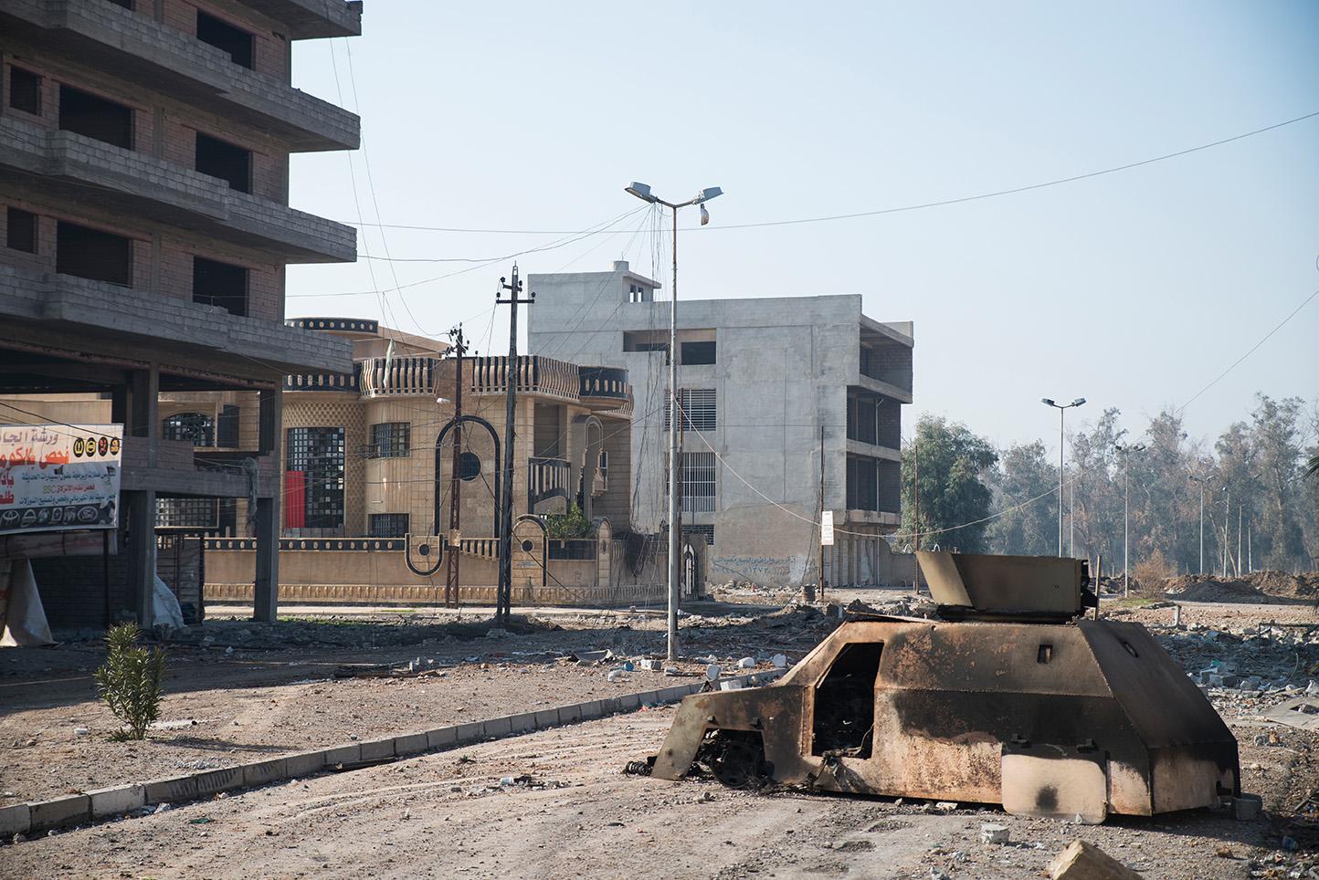 Mosul, Iraq. A homemade car constructed by ISIS to carry out a suicide attack blocks a road in...