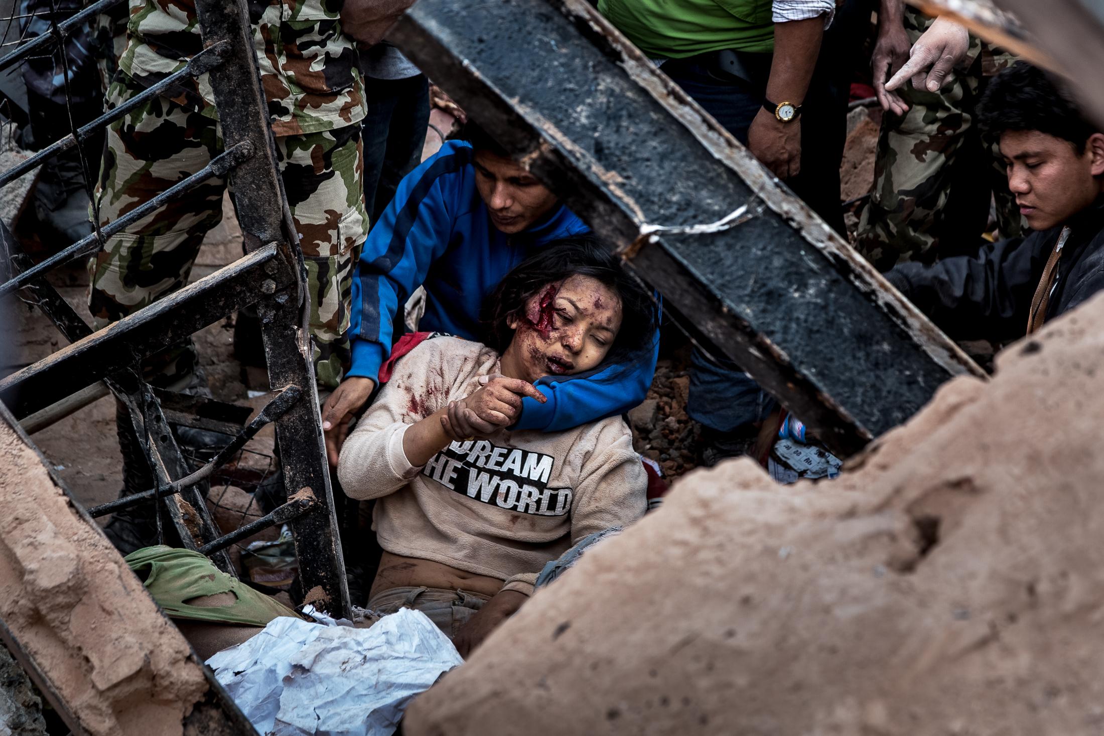 When the Earth Shook Nepal - KATHMANDU, NEPAL - APRIL 25: Emergency rescue workers and...