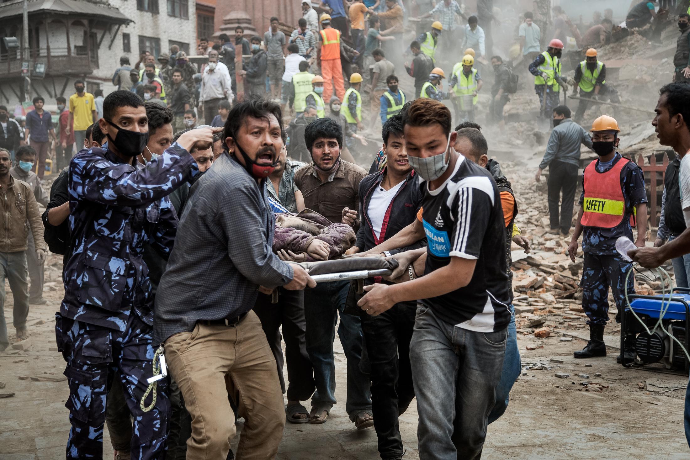 When the Earth Shook Nepal - KATHMANDU, NEPAL - APRIL 25: Emergency rescue workers and...