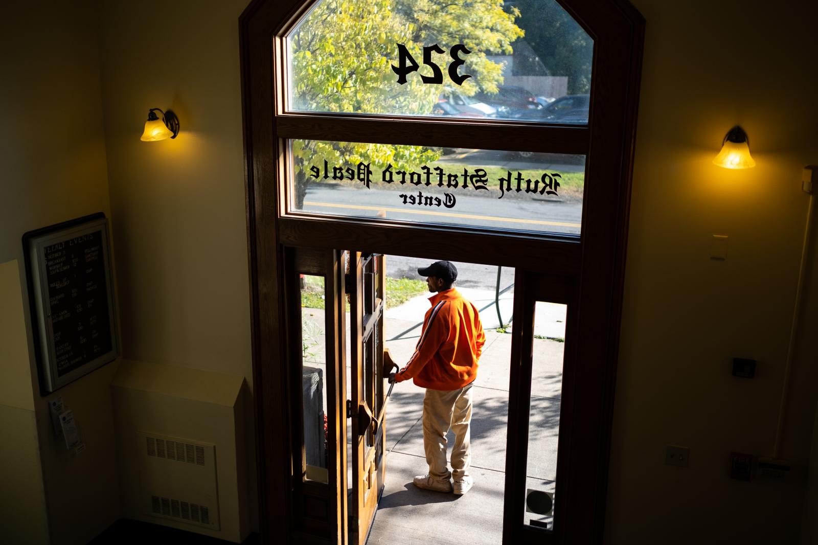 Image from The Church - Richard waits at the door to ensure that people exiting...