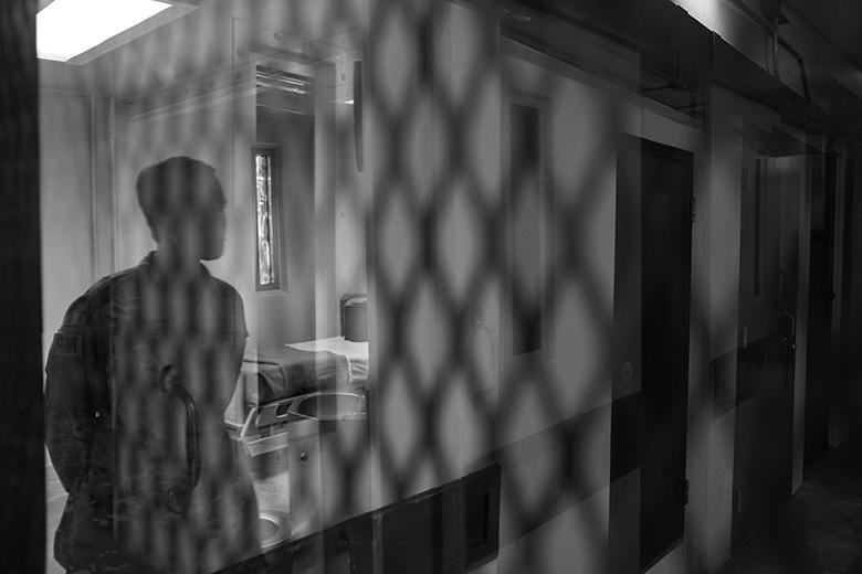 The reflection of a US soldier inside Camp V&#39;s newest detainee medical unit, became...