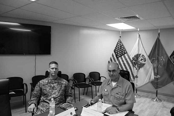 Col. Stephen E. Gabavics, Joint Detention Group Commander (left) and Rear Admiral John C. Ring,...