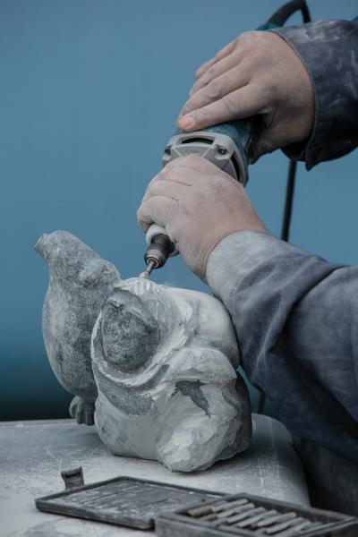 Image from Six Arctic Seasons - July 2019 Leo carves a grandmother an seal in basalt stone