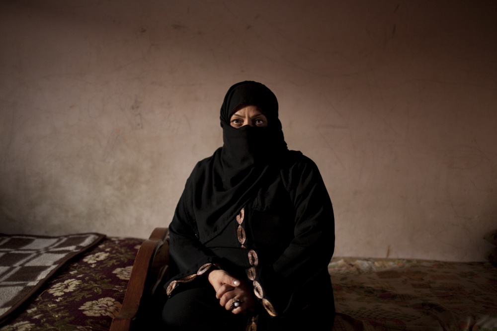Prisoners of a Revolution - Ateyat, 42, mother of Moneer, a protester who was...
