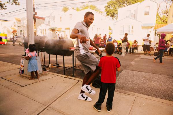 Block Party - Normando Nelson dances during the block party in...