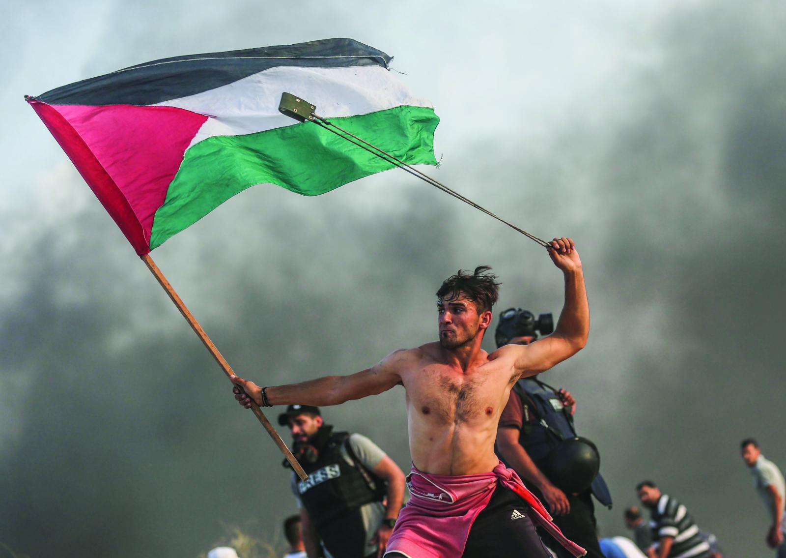 a shirtless young protester in ... Israel for 12 years until now.