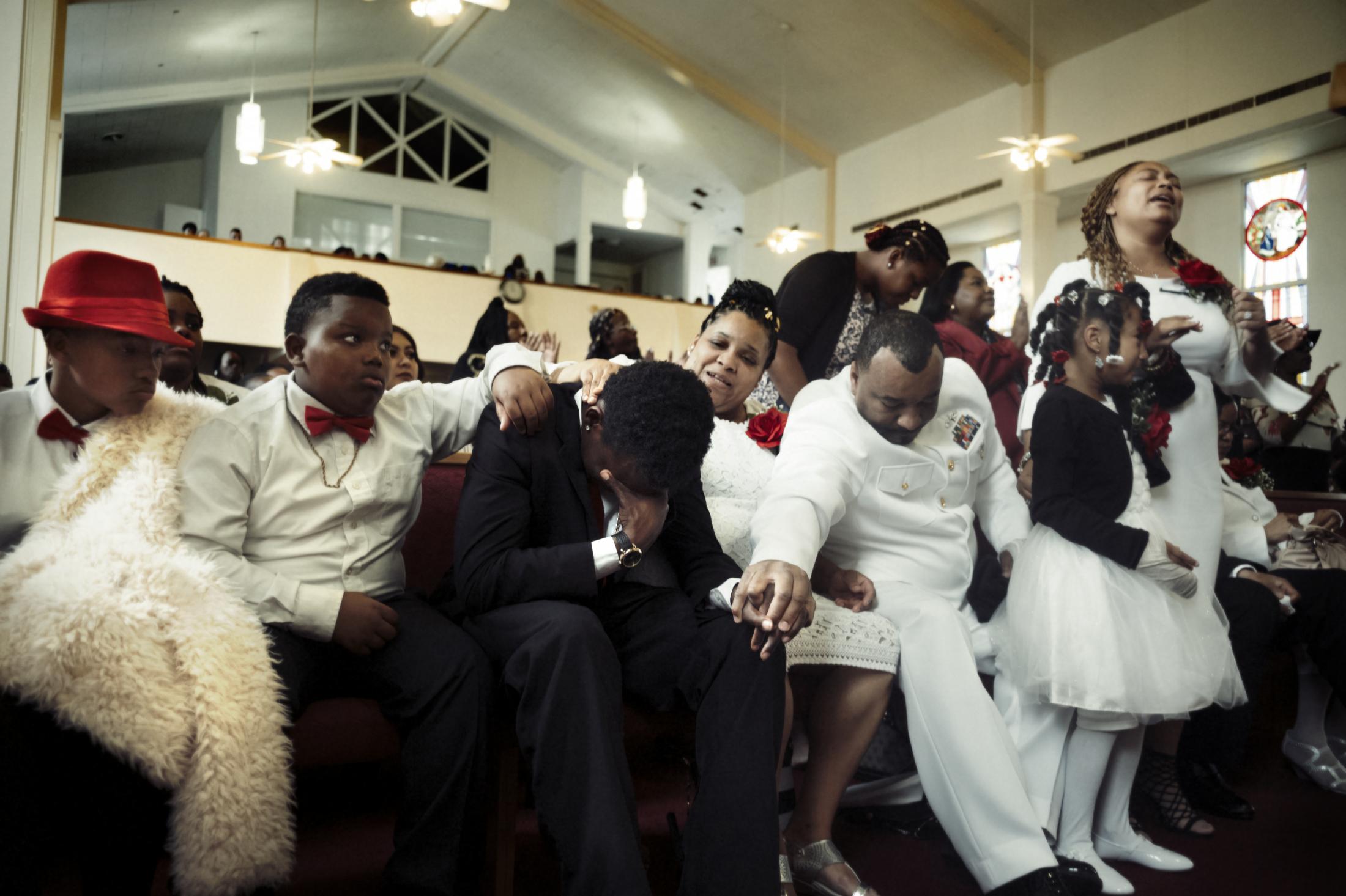 Coming of Age - The family of Zurich Chatman mourns his loss at a funeral...
