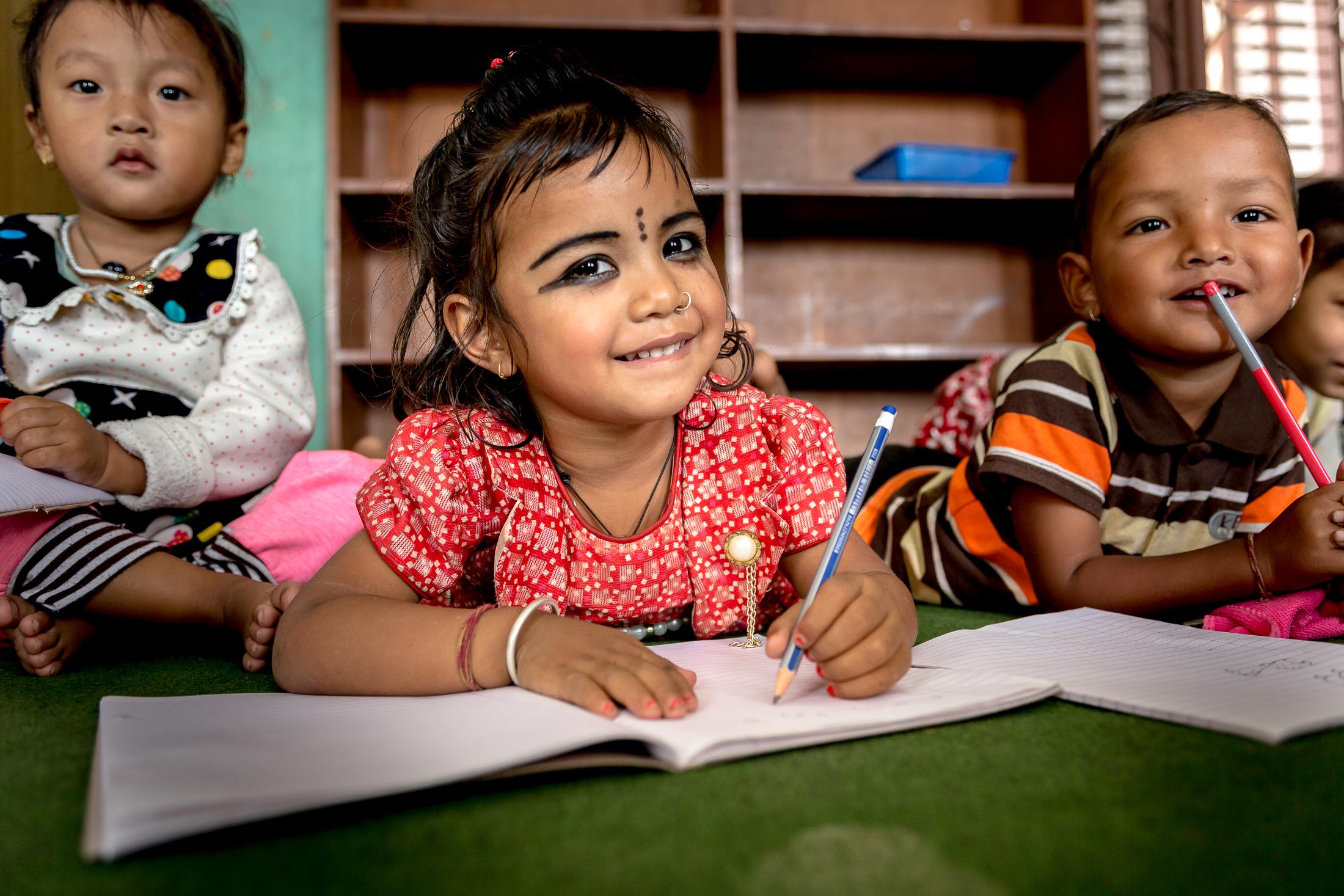 Portfolio NGO Education  - SIDDHIPUR, NEPAL - MAY 08: A young girl smiles as she...