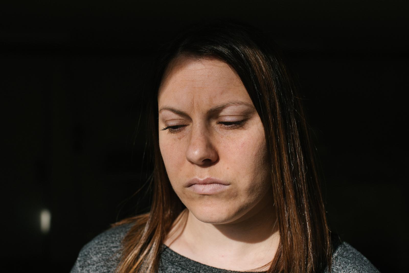 Erica Tarr, 31, stands for a po...her house. Photo by Hannah Yoon