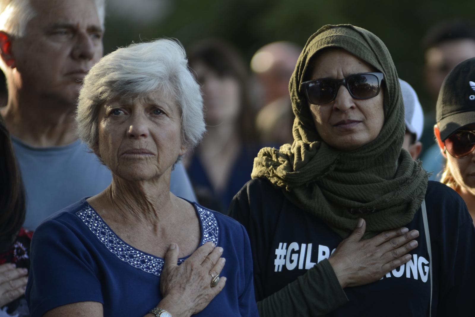Attendants at a vigil outside o...y 29, 2019. REUTERS/Kate Munsch