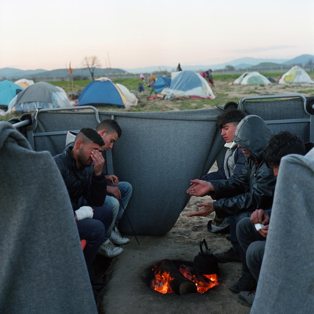 Young Syrian men are heating up... in Idomeni, Greece. March 2016