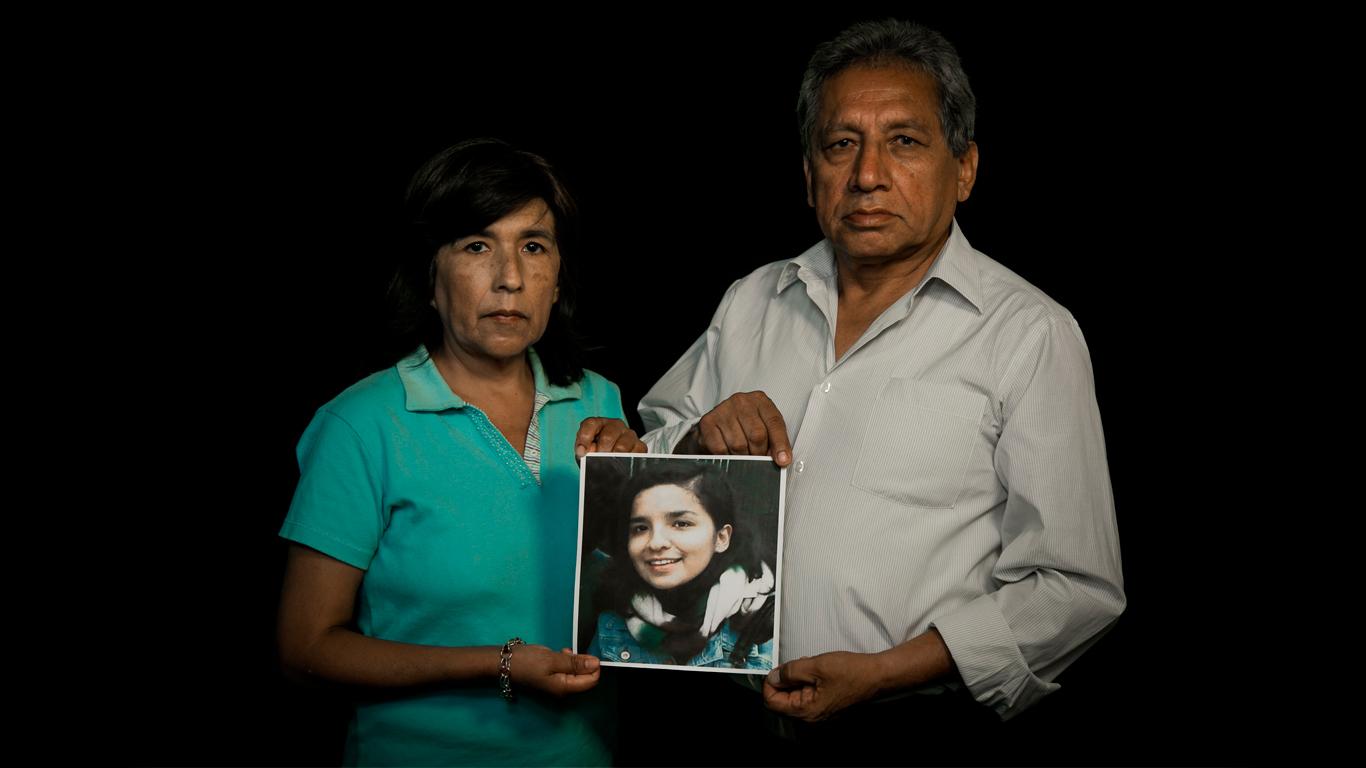 Desaparecidas, 2018 - Rosario and Carlos Rodríguez hold the portrait of...