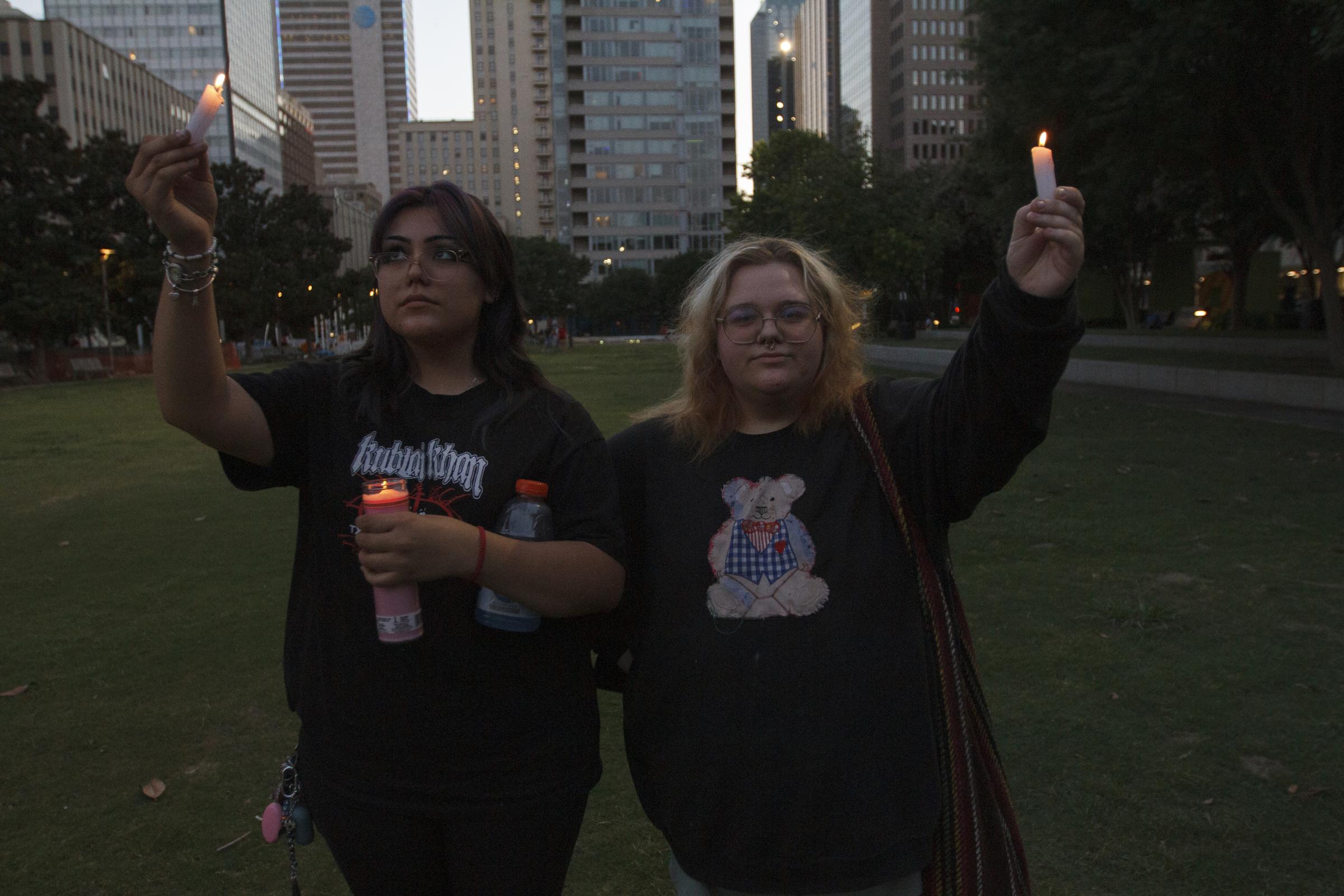 Candlelight Vigil for the Buffalo and Uvalde gun violence victims - Ashley Garcia (left) and Emma Stubblefield hold candles during the candlelight vigil held at Main...