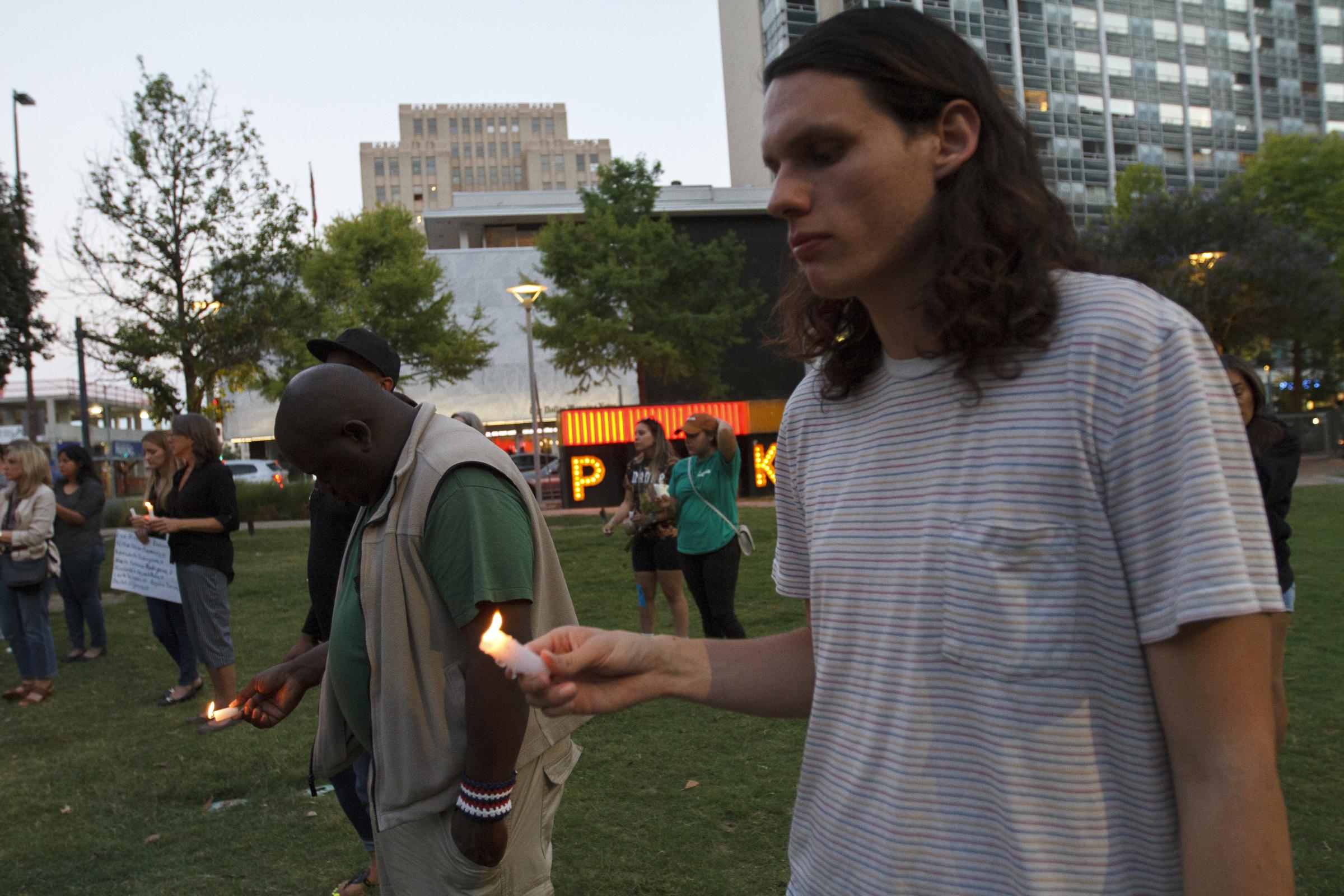 Candlelight Vigil for the Buffalo and Uvalde gun violence victims - James Perkins (right) a  Social Work student at TWU attends the candle vigil held at downtown...