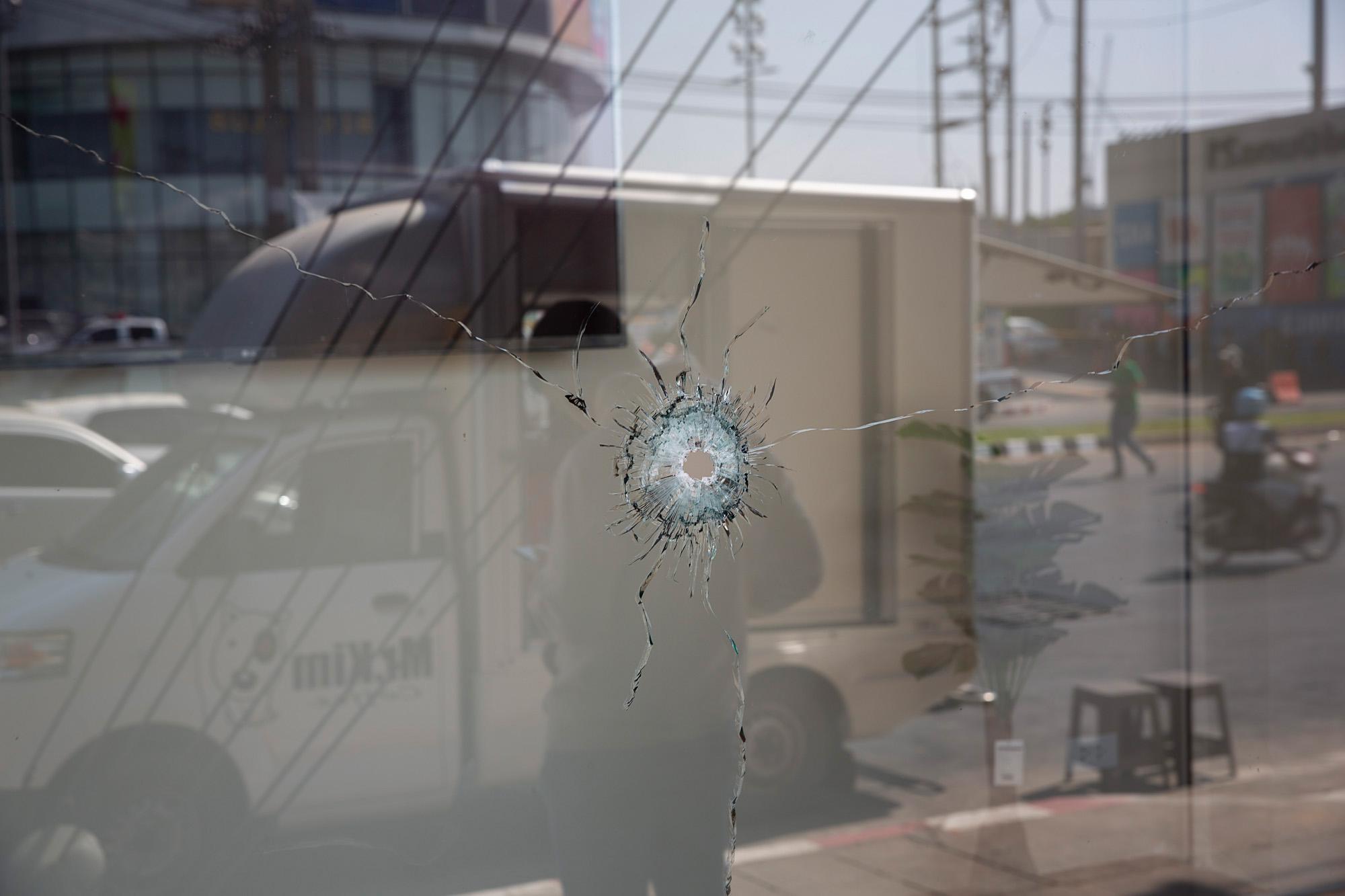 A bullet hole created by gunfire from Seargent Major Jakrapanth Thomma, 32, is seen in a shop window in Korat, Thailand, February 2020.&nbsp;