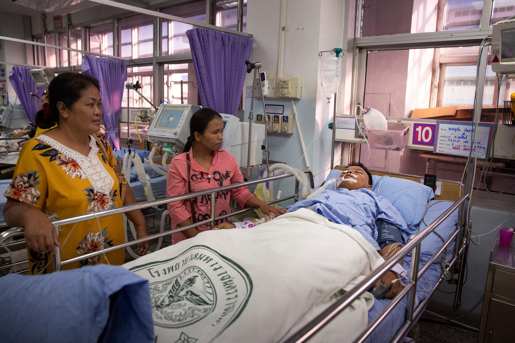 A man, wounded by Seargent Major Jakrapanth Thomma, 32, who went on a shooting spree, lays on a bed in a hospital in Korat, Thailand, February...
