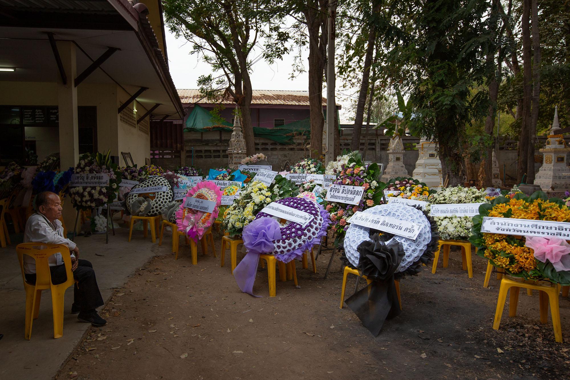 Shooting in Korat, Thailand: The New York Times - Wreaths are seen at a memorial for those killed during...