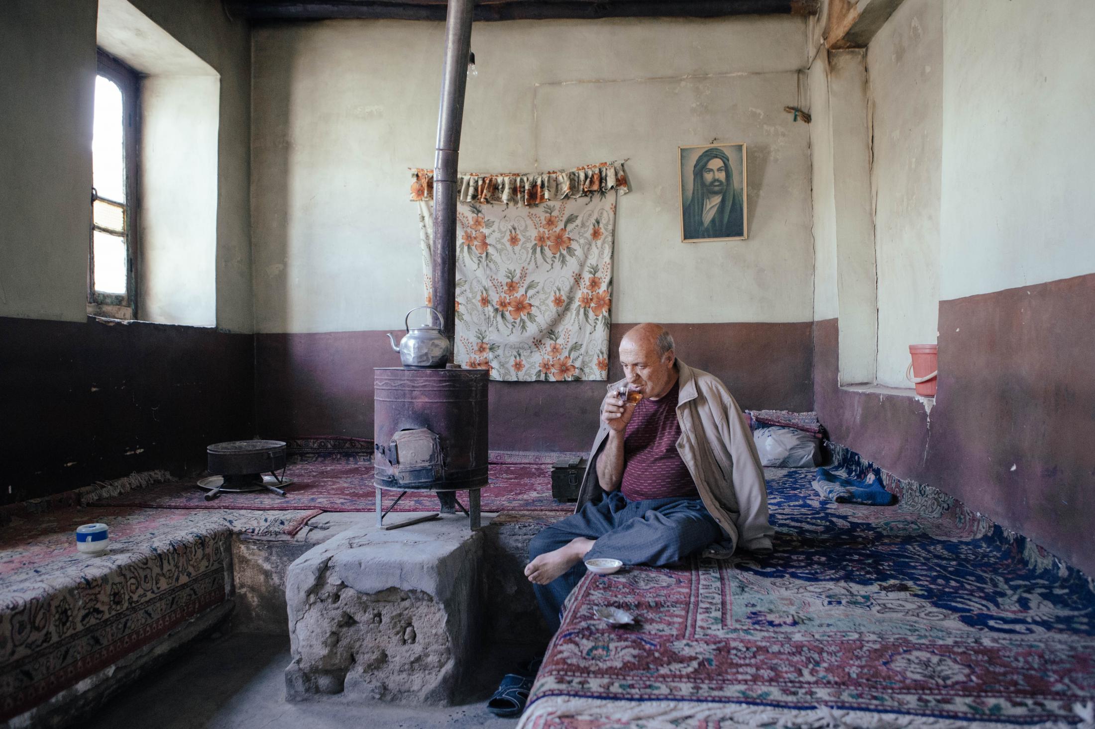 THE EYES OF EARTH (THE DEATH OF LAKE URMIA 2014-ONGOING) -   Mohammad, 55, is drinking tea in his traditional...