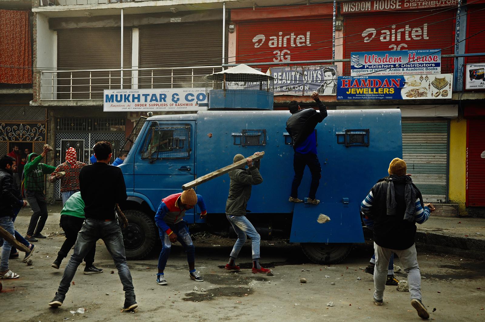 Protesters attack an Indian paramilitary vehicle after a 16 year old youth, Rizwan Mir, who was injured during a road accident by an Indian...