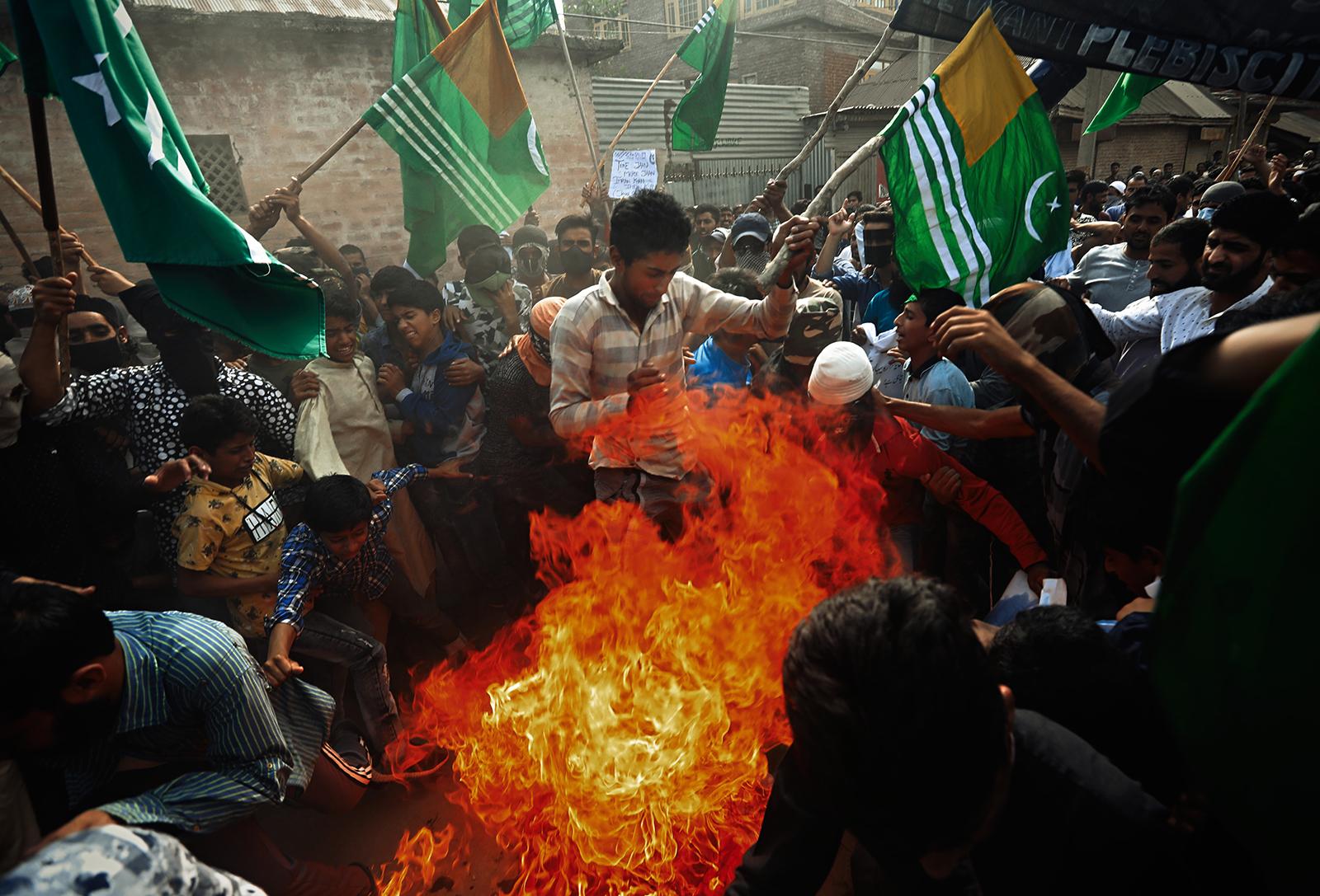 Kashmir-The Never Ending War - Protesters burn effigy of Indian Prime Minister Narendra...