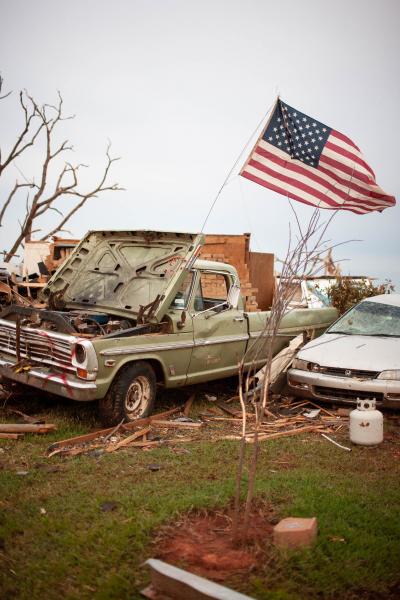 Image from PORTFOLIO - Volunteers placed flags they found in one neighborhood of...