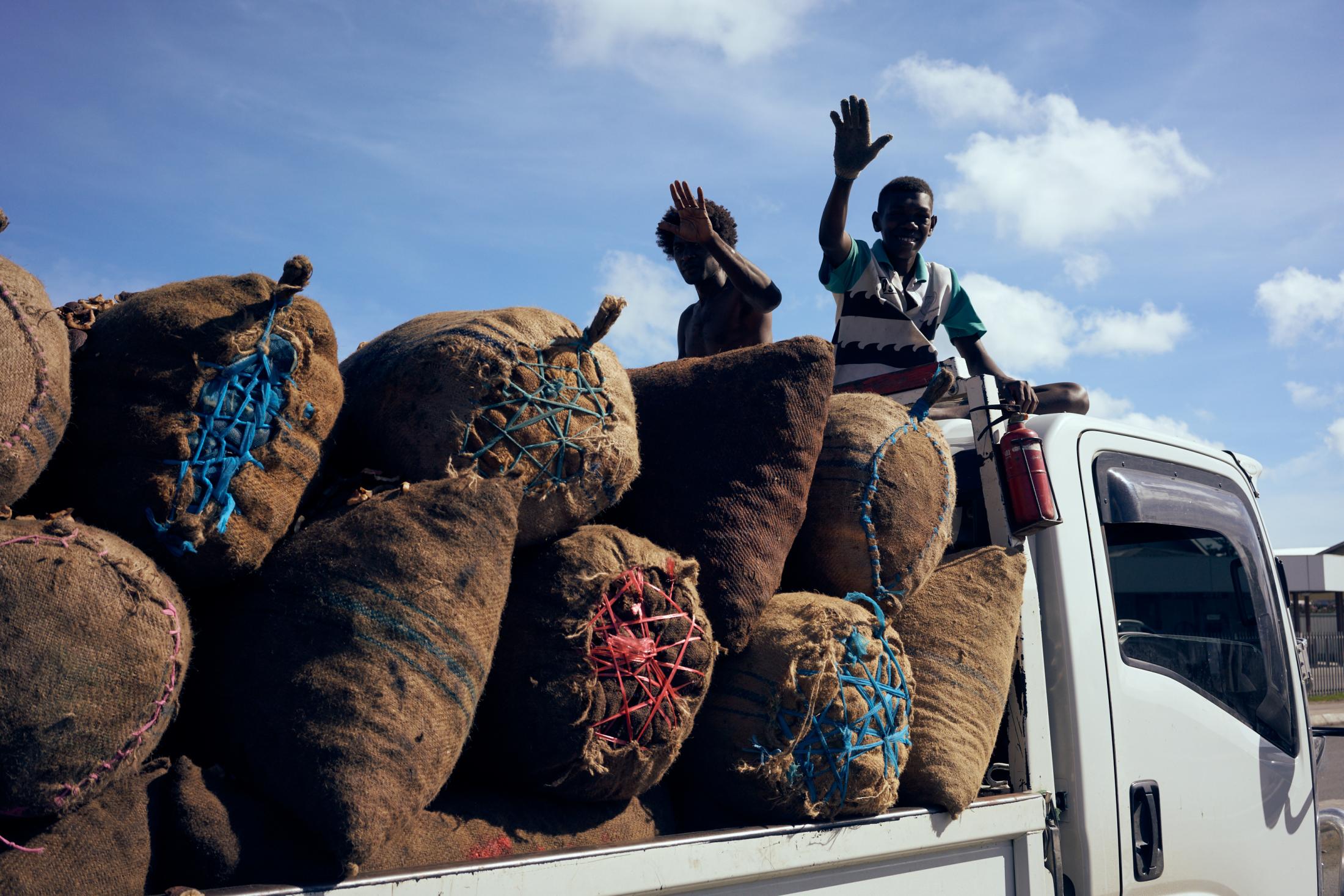 IFAD Photo Mission 2019 - Transporting bags of cocoa beans through the streets of...
