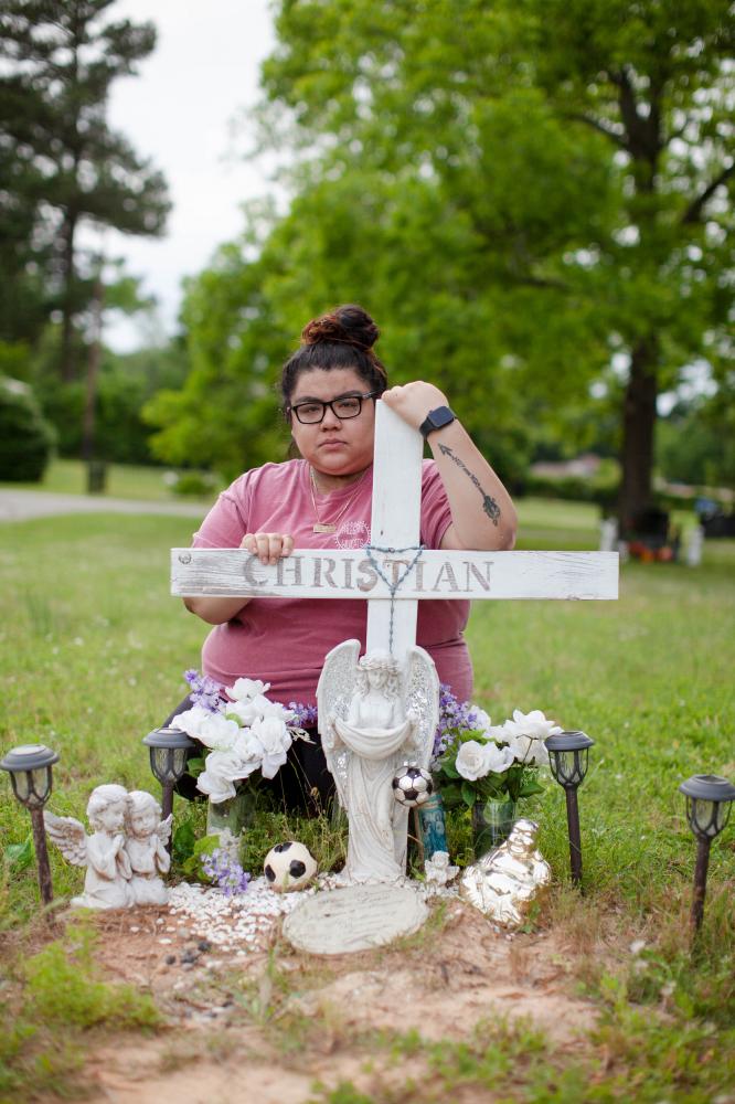 Zaira Gonzales poses for a portrait by the grave of her brother, Christian Gonzalez, in...