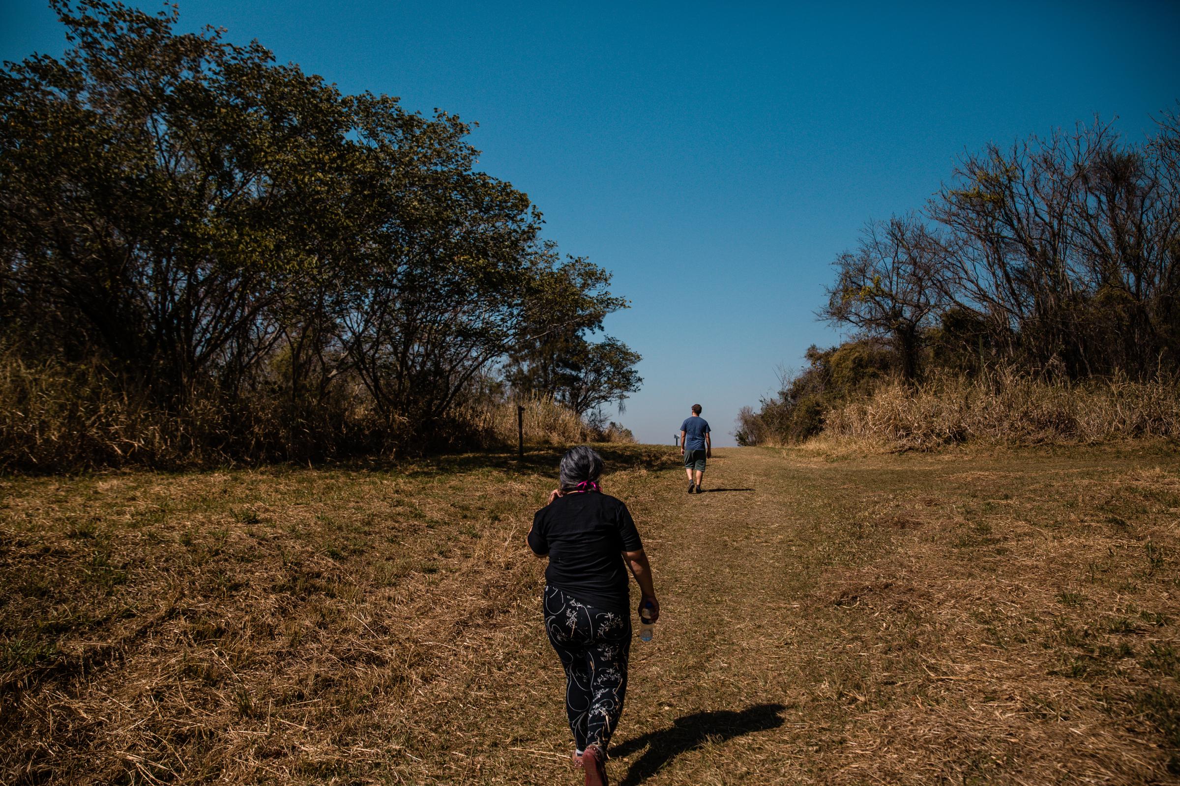 Morro de Ipanema - Two people walking on the open tracks of Ipanema...