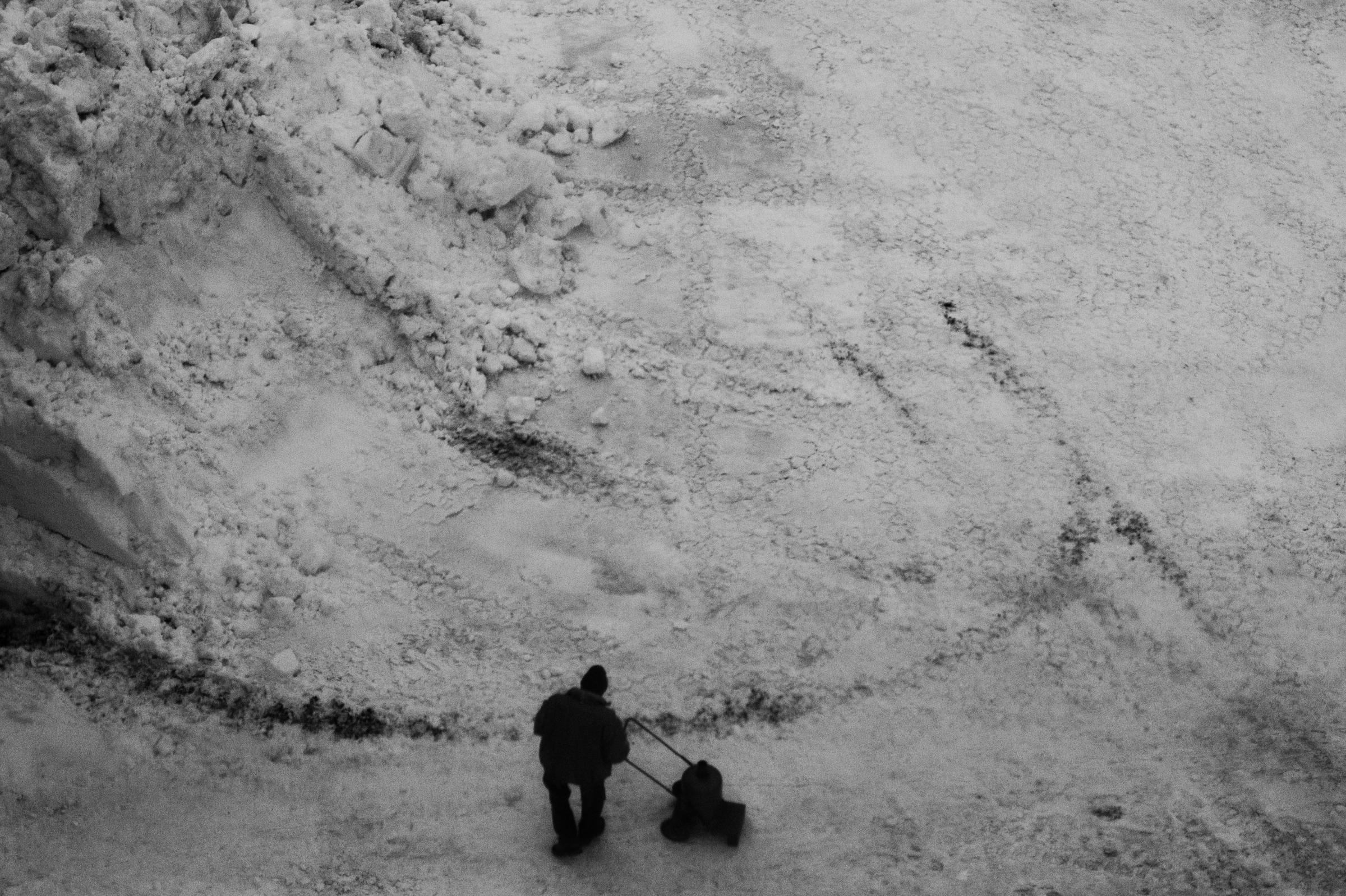Chamonix - Man walking through the snow during winter in Chamonix