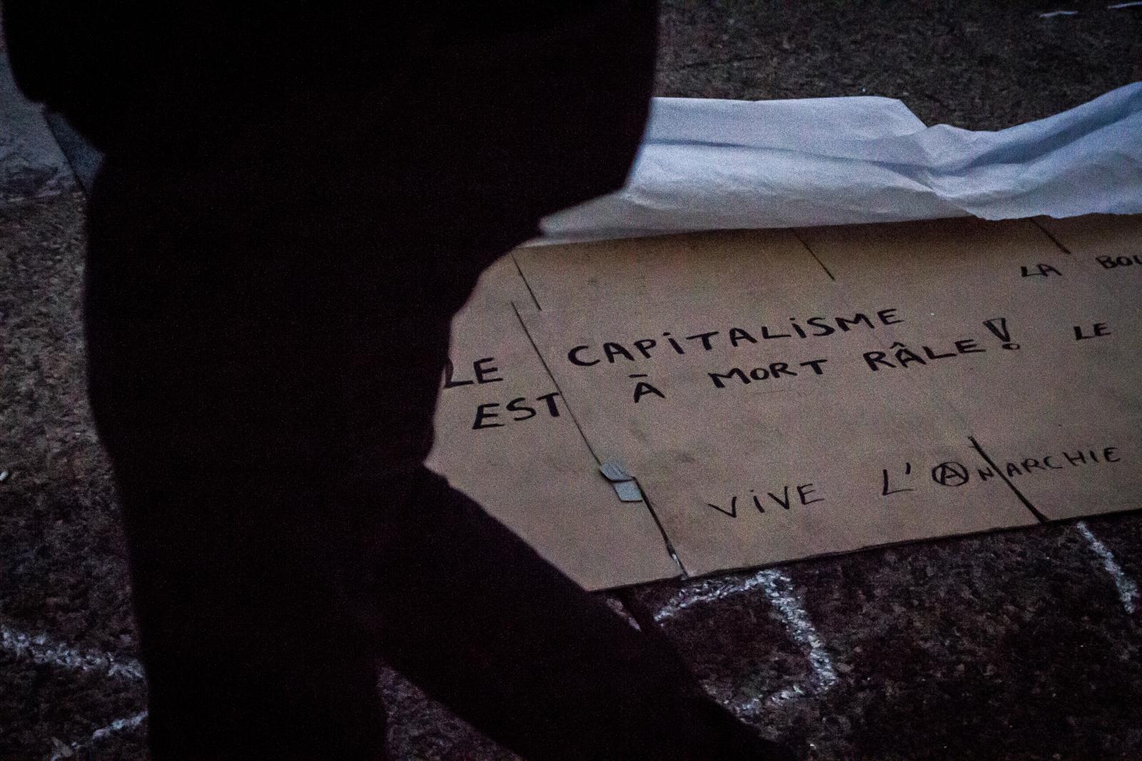 Occupy la Défense - Banner on the floor with message protesting against the...