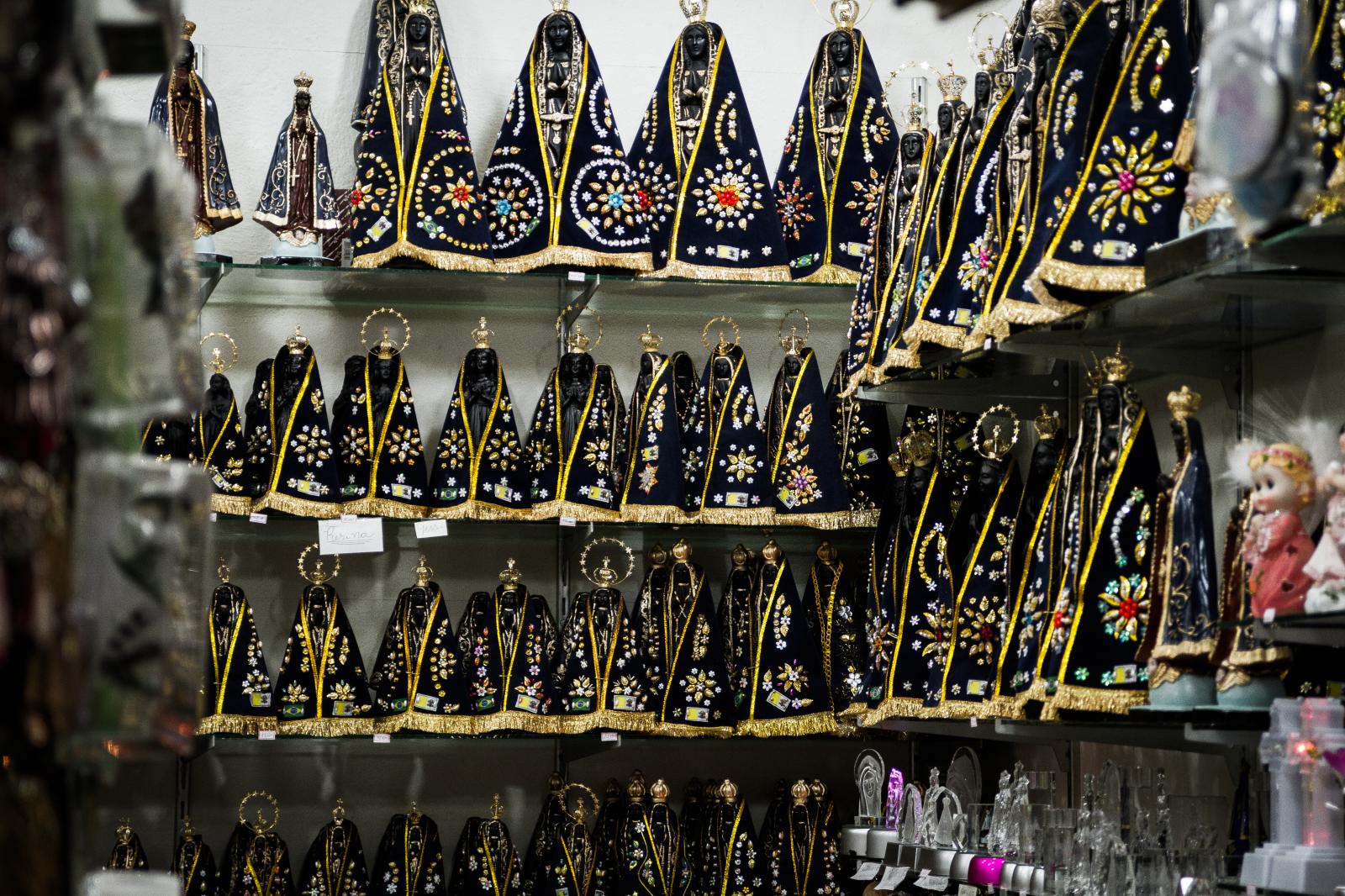 Payer of promises - The statues of Our Lady of Aparecida for sale in a store....