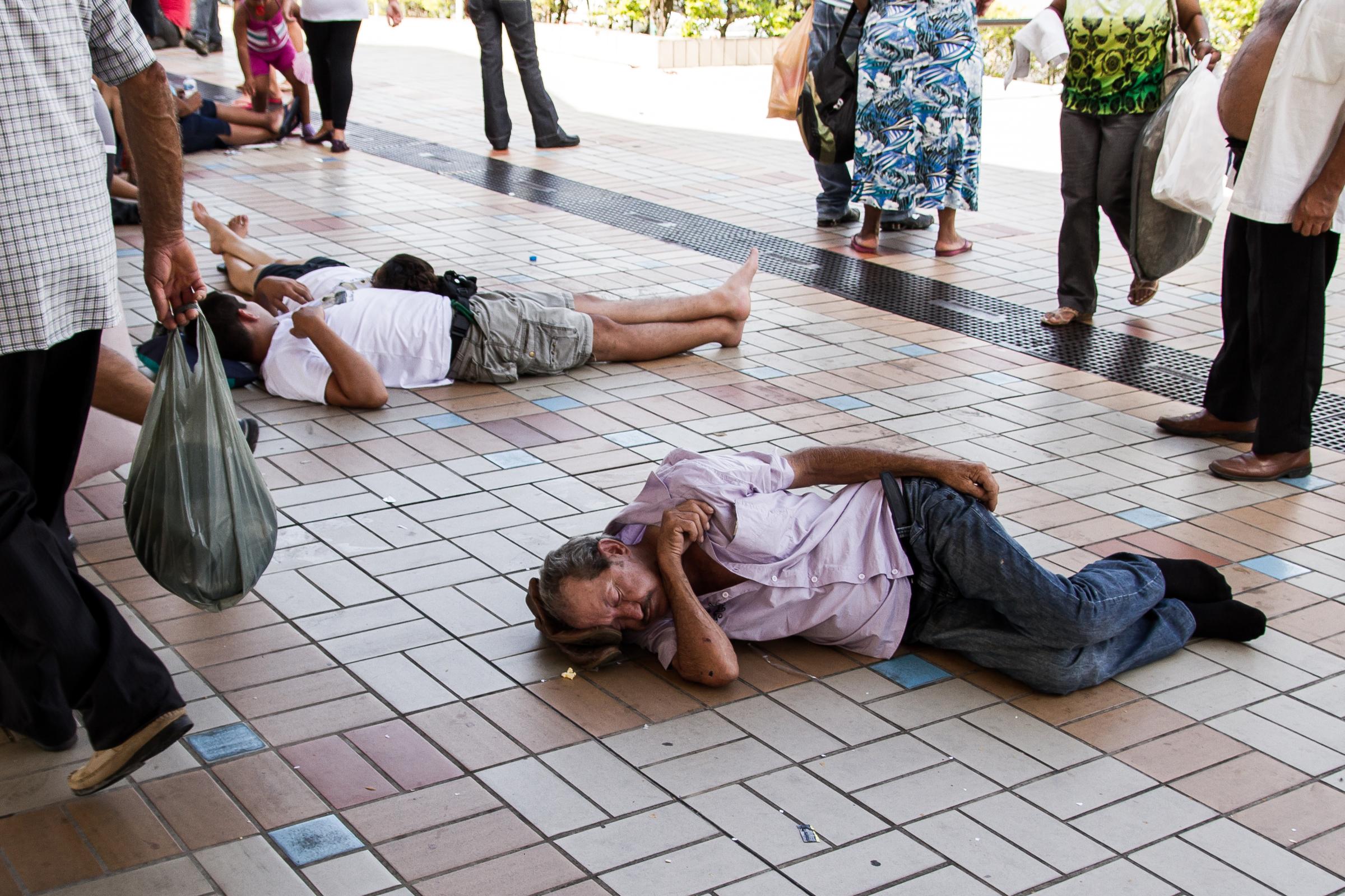 Payer of promises - People resting on the floor, napping after the day in the...