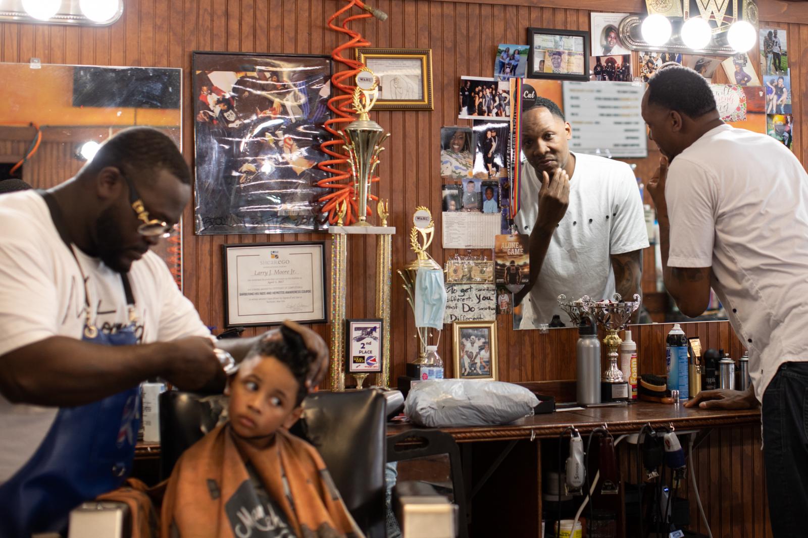Larry Moore cuts Marcus Douthit...Life on the Edge Barber Lounge.