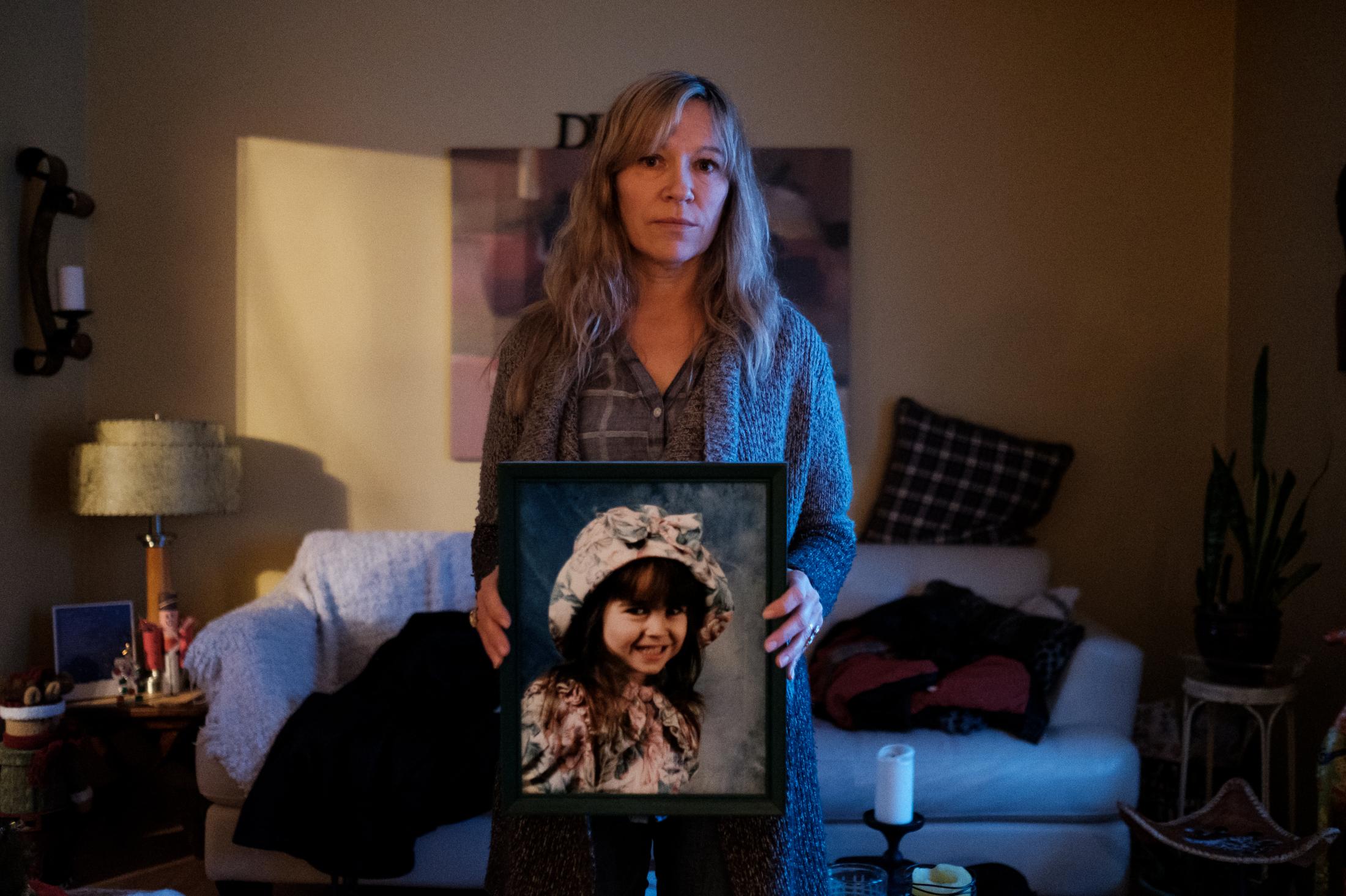 People - Joyce Holmes holds a photo of her daughter, Meagan...