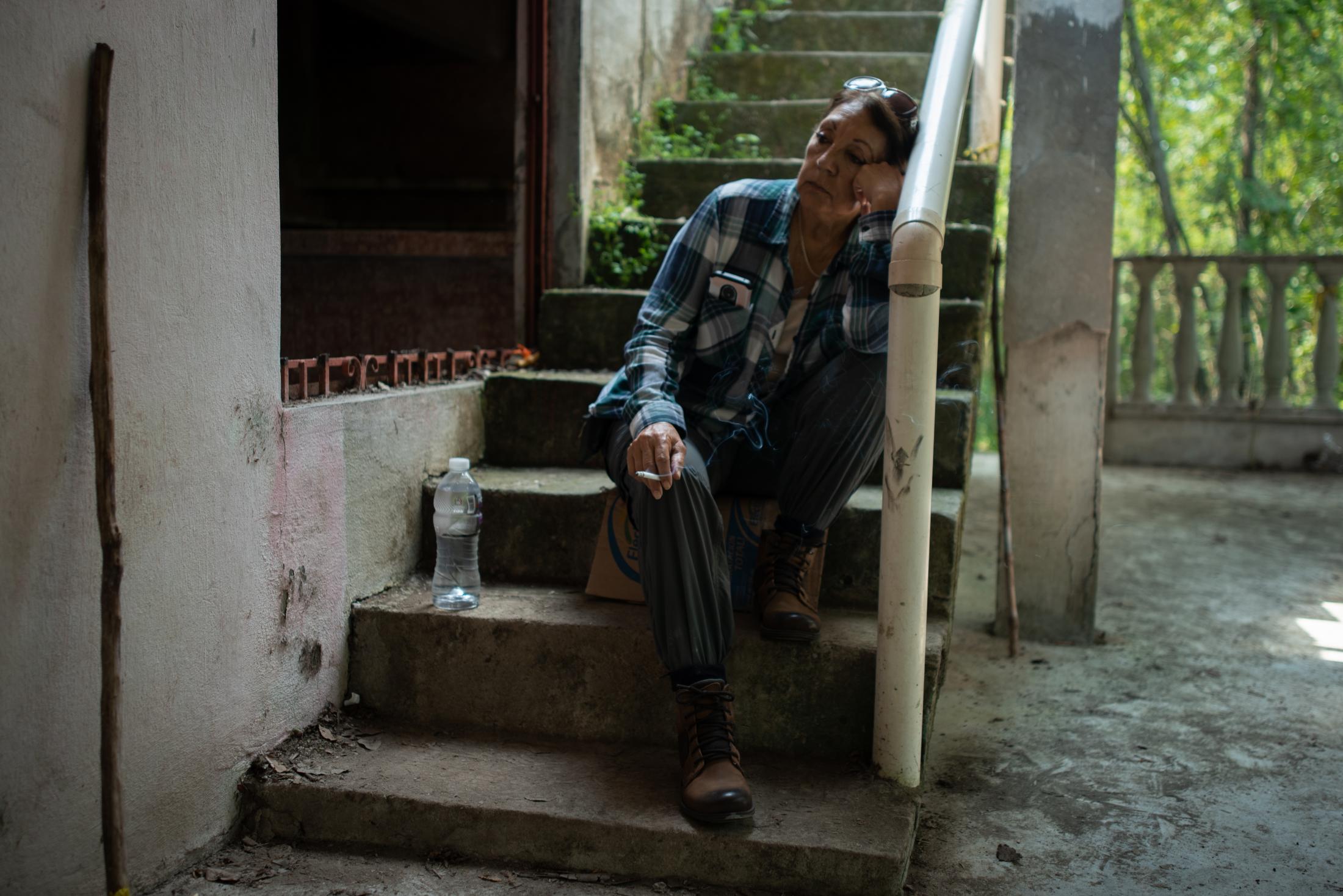 Teresa Figueroa, 66, seeker from Baja California, Mexico, rests inside the house located in the...