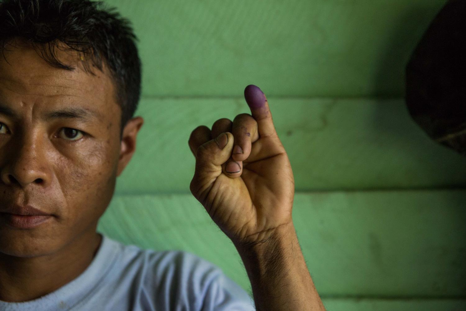 Kyaw Naing, 36, displays his in...tory. (AP Photo/Amanda Mustard)